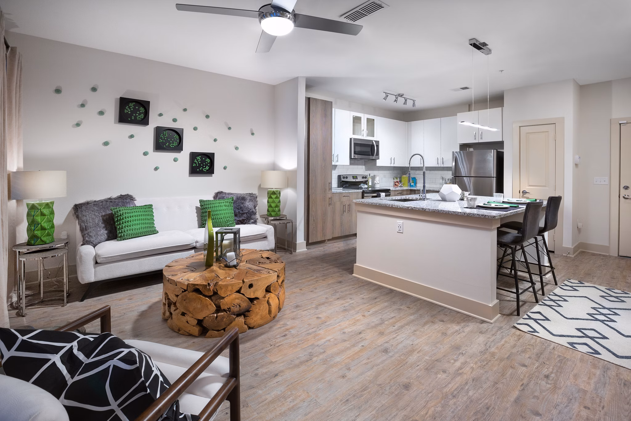 Modern living room with ocean views at Sea Glass Apartments, featuring premium furnishings