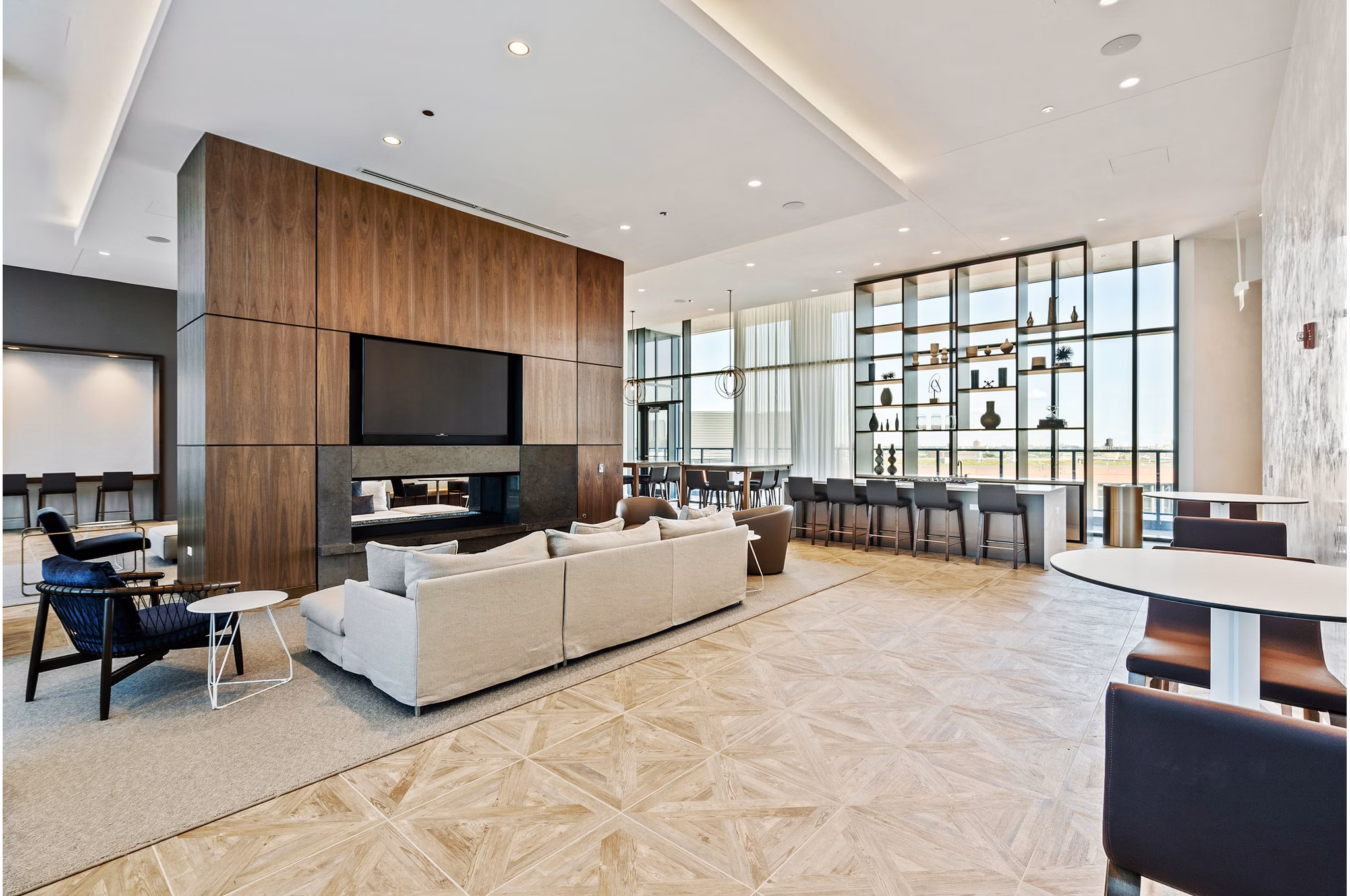 Modern clubhouse with plush seating and art installations at Elevate Apartments, perfect for social gatherings and relaxation