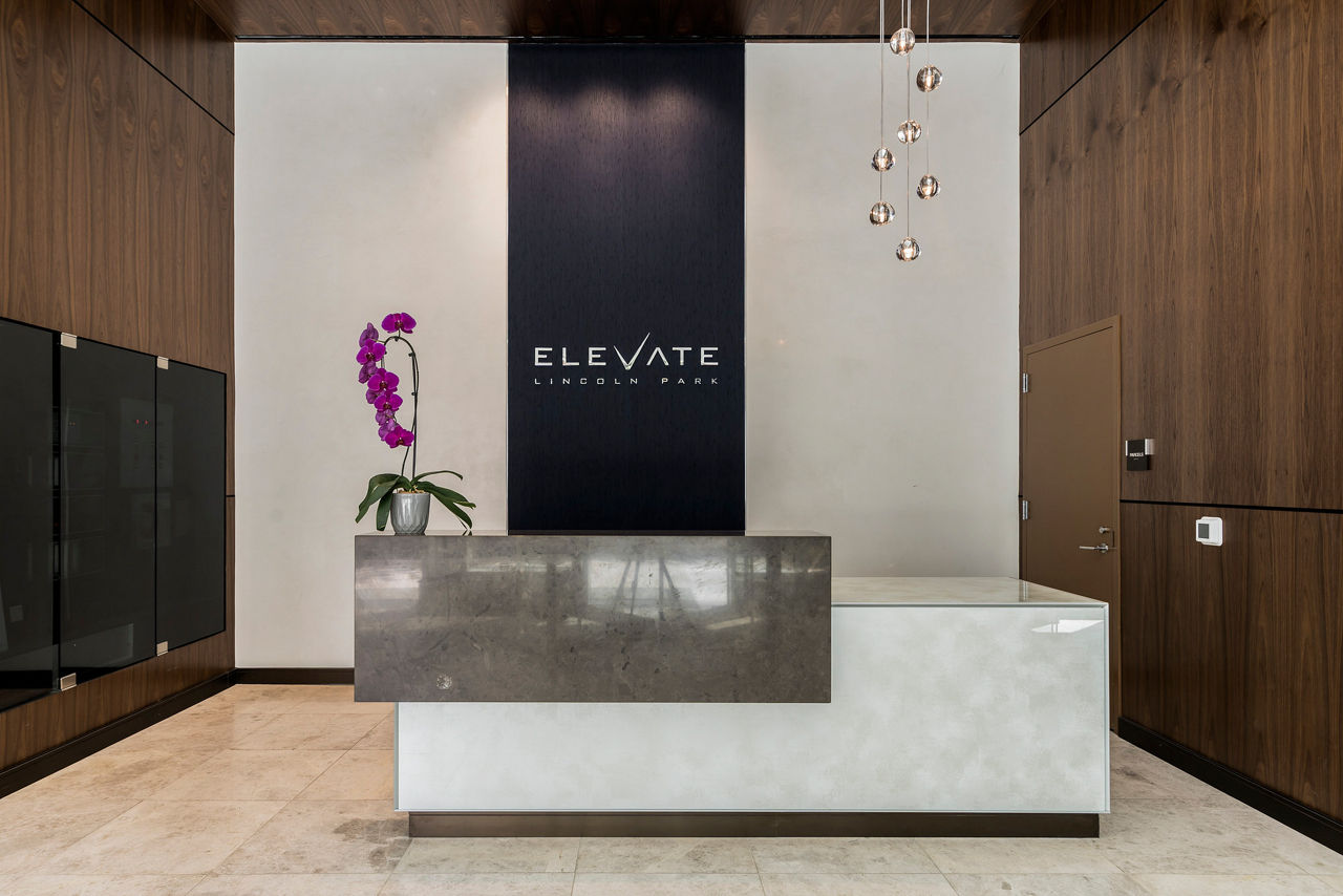 Modern front lobby with sleek furnishings at Elevate Apartments