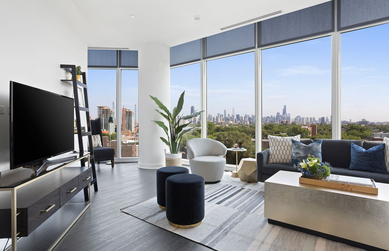 Living room with modern furniture and natural light in Elevate Apartments