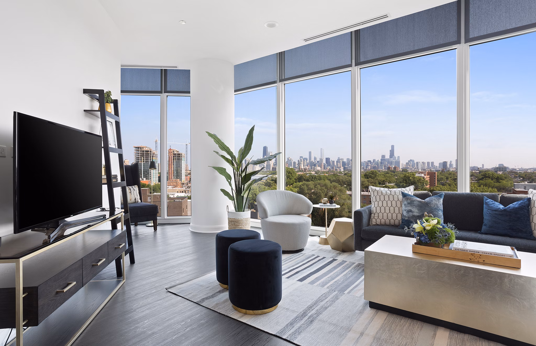 Living room with modern furniture and natural light in Elevate Apartments
