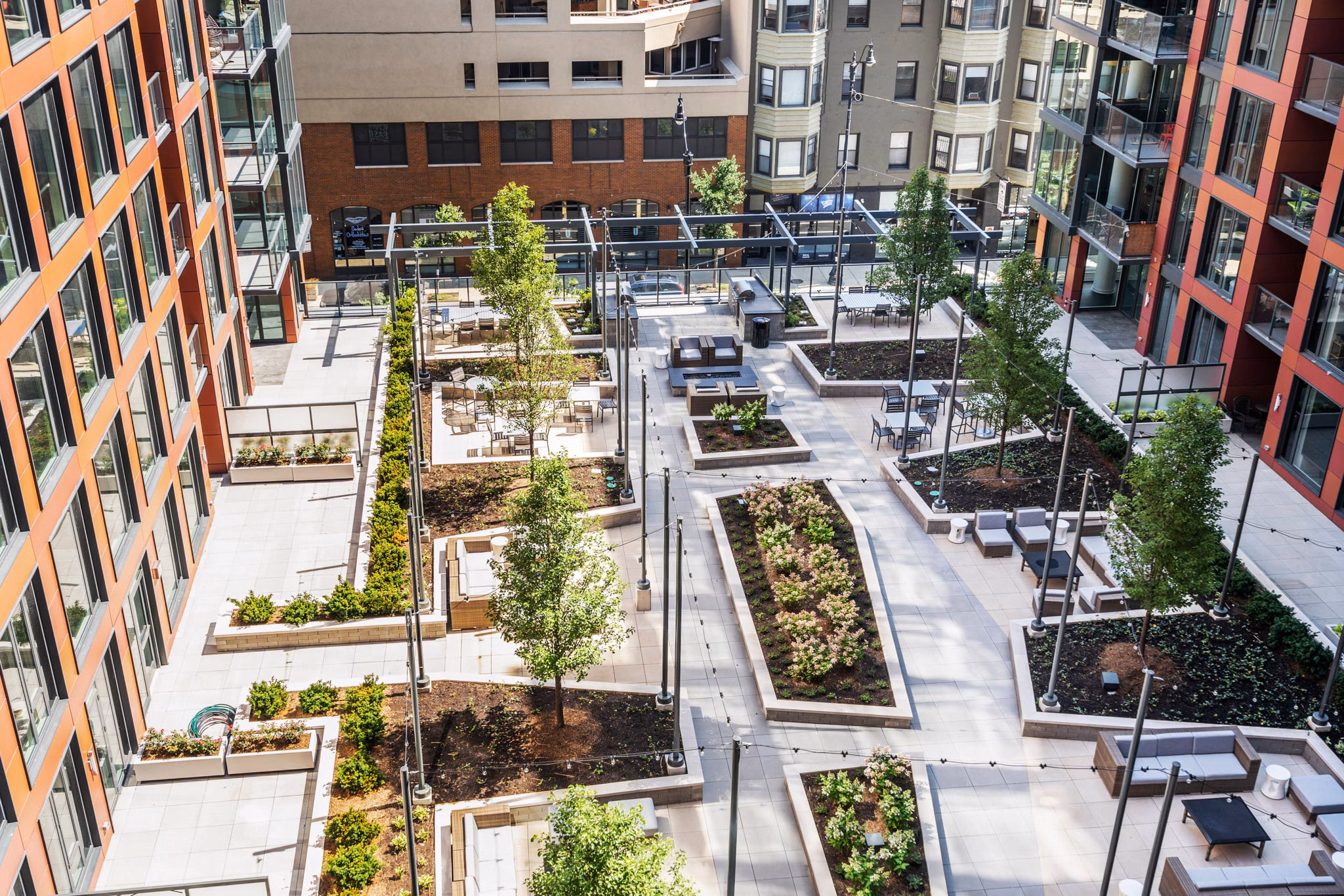 Courtyard featuring lush landscaping and seating areas at Elevate Apartments, a premier location for relaxation and outdoor activities