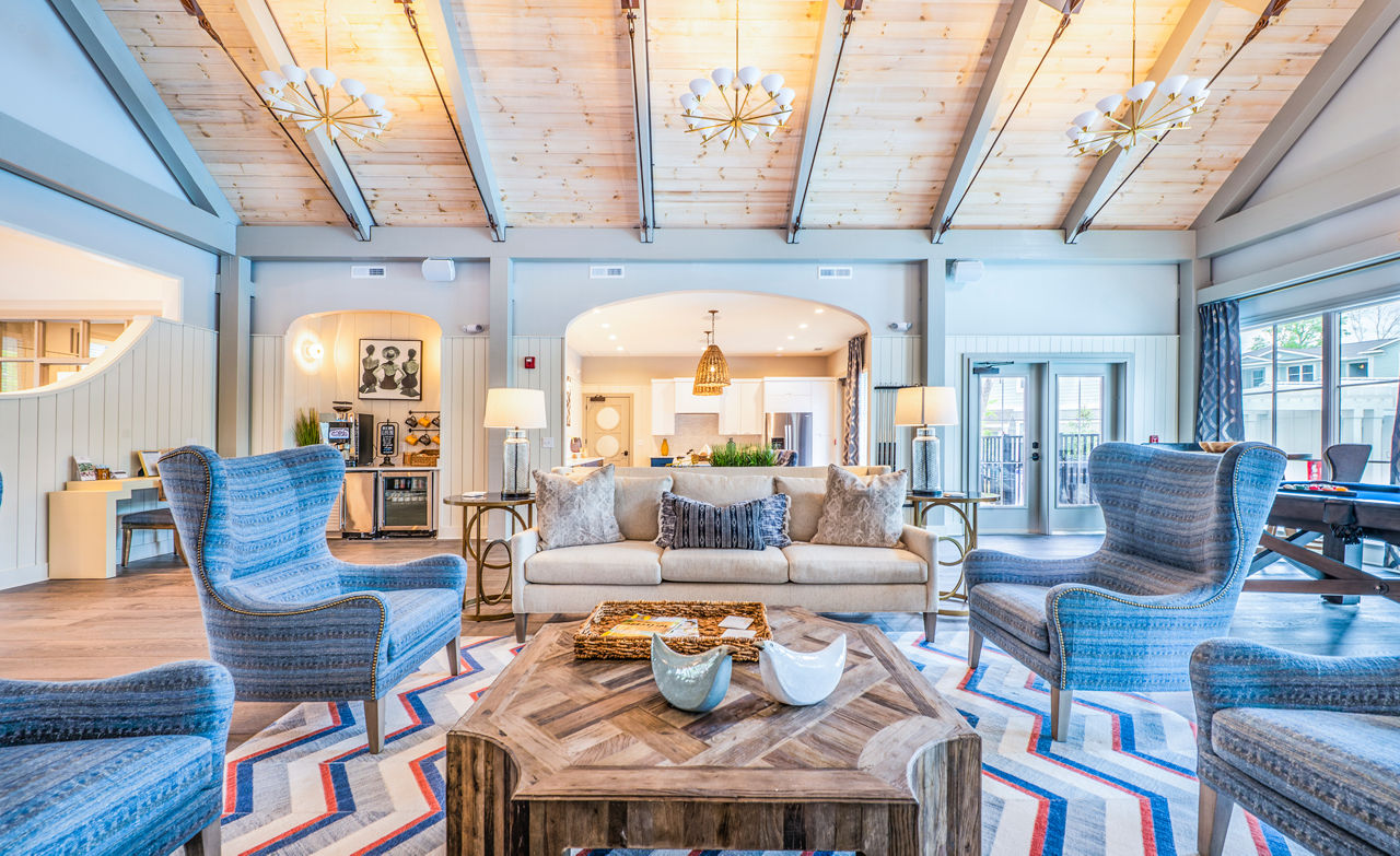 Elegant clubhouse with modern seating and decor at Atlantic at Grand Oaks Apartments