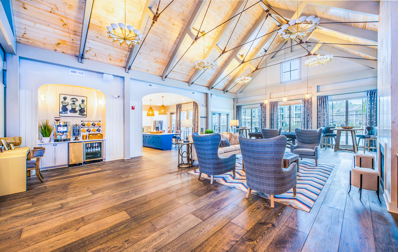 Spacious clubhouse with modern decor at Atlantic at Grand Oaks Apartments for luxury living