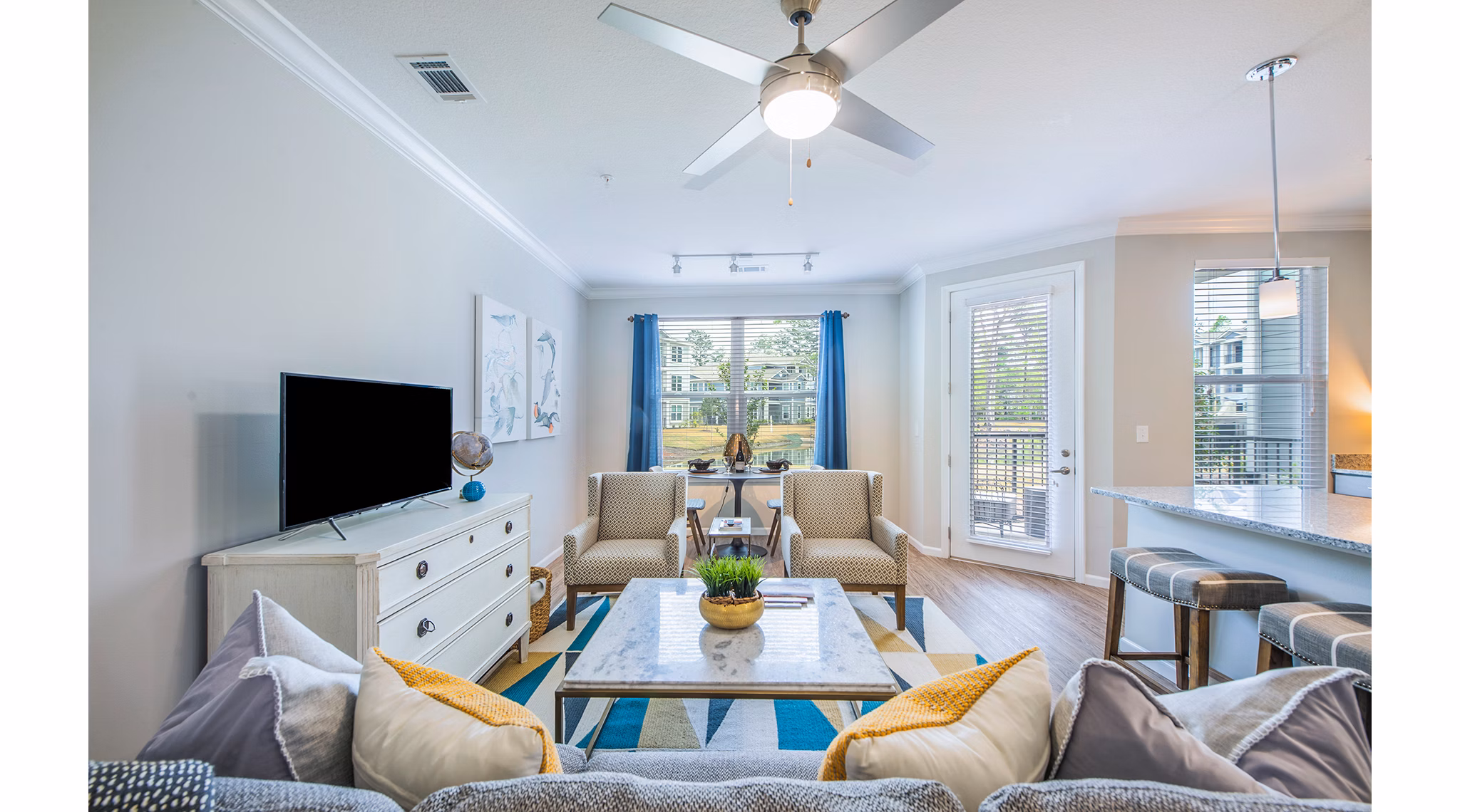 Spacious living room with modern decor and natural light at Atlantic at Grand Oaks Apartments