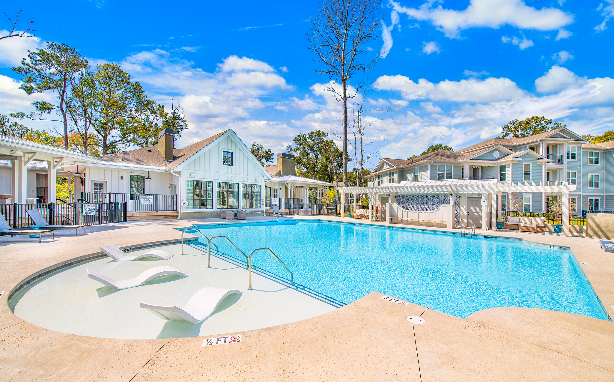 Beautiful poolside at Atlantic at Grand Oaks Apartments offering luxury leisure amenities in a serene setting