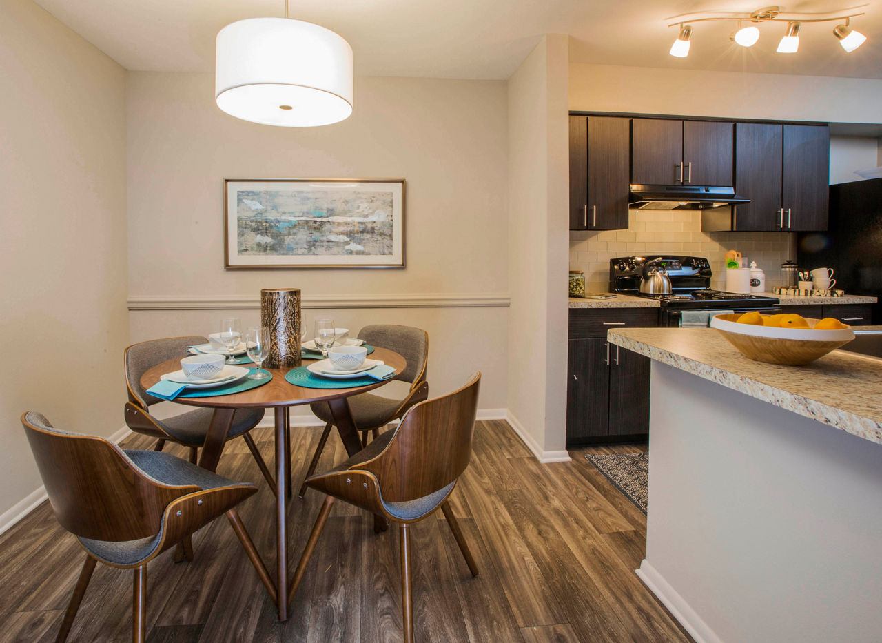 Dining area with modern furnishings at Lakeside Mill Apartments