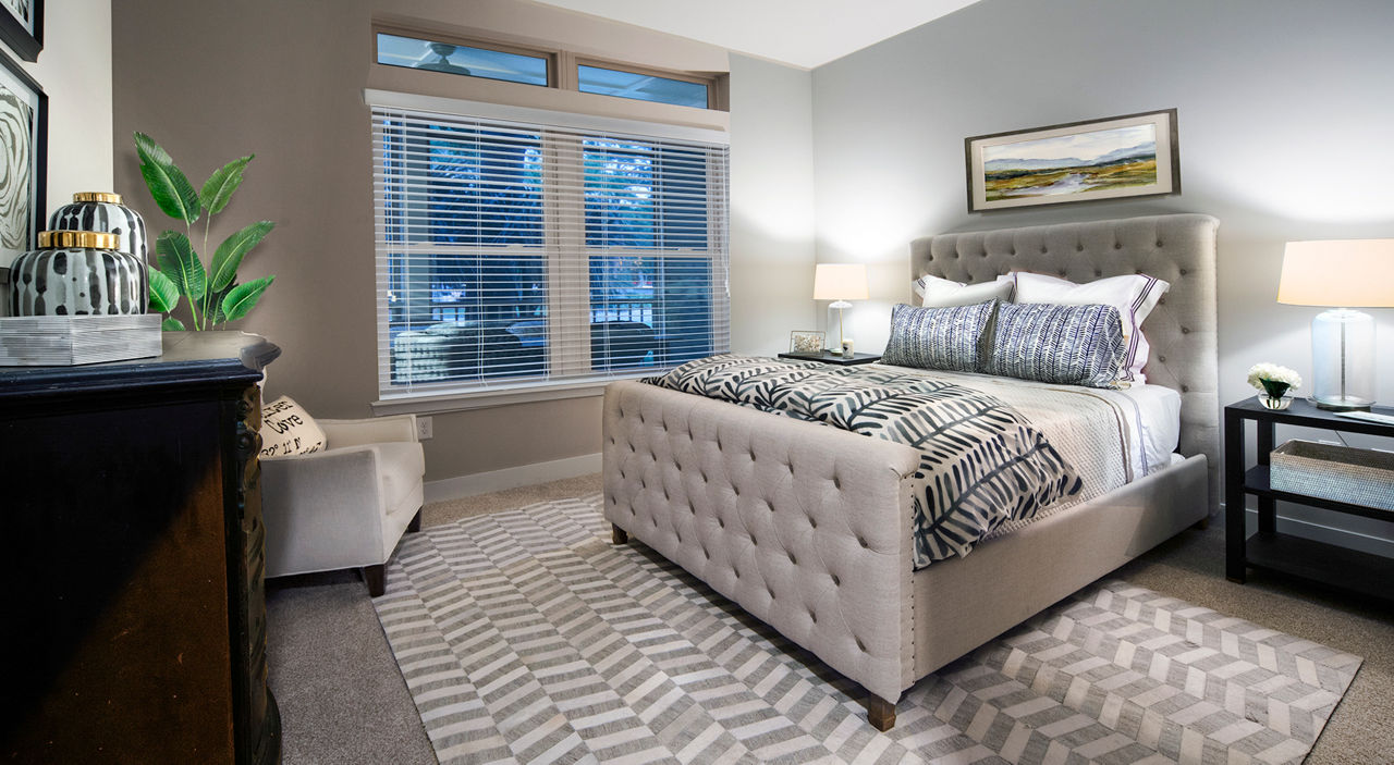 Elegant bedroom with serene decor at WaterWalk luxury apartments, Shelter Cove Towne Centre