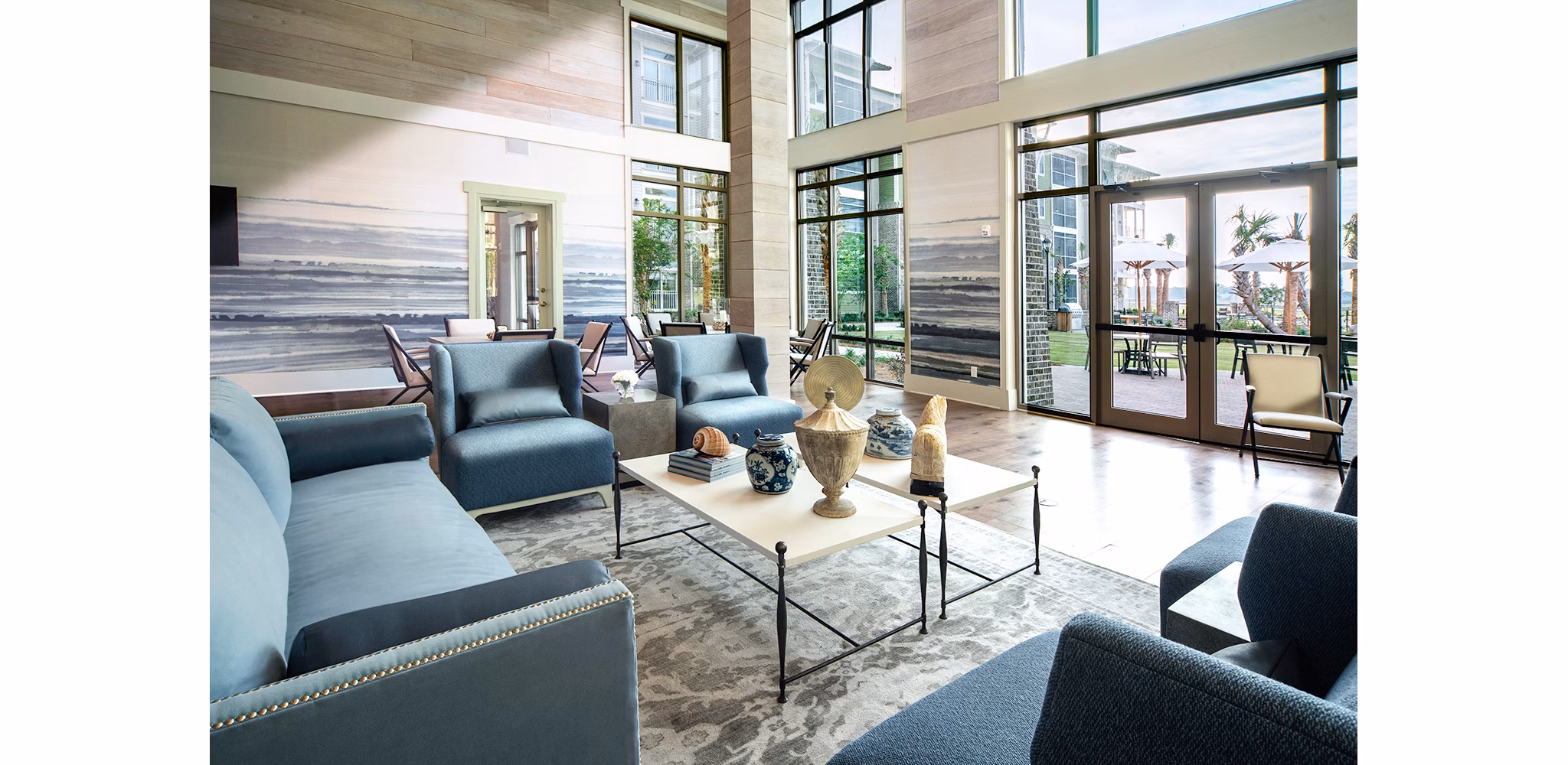 Clubhouse featuring modern design and communal seating at WaterWalk at Shelter Cove Towne Centre luxury apartments