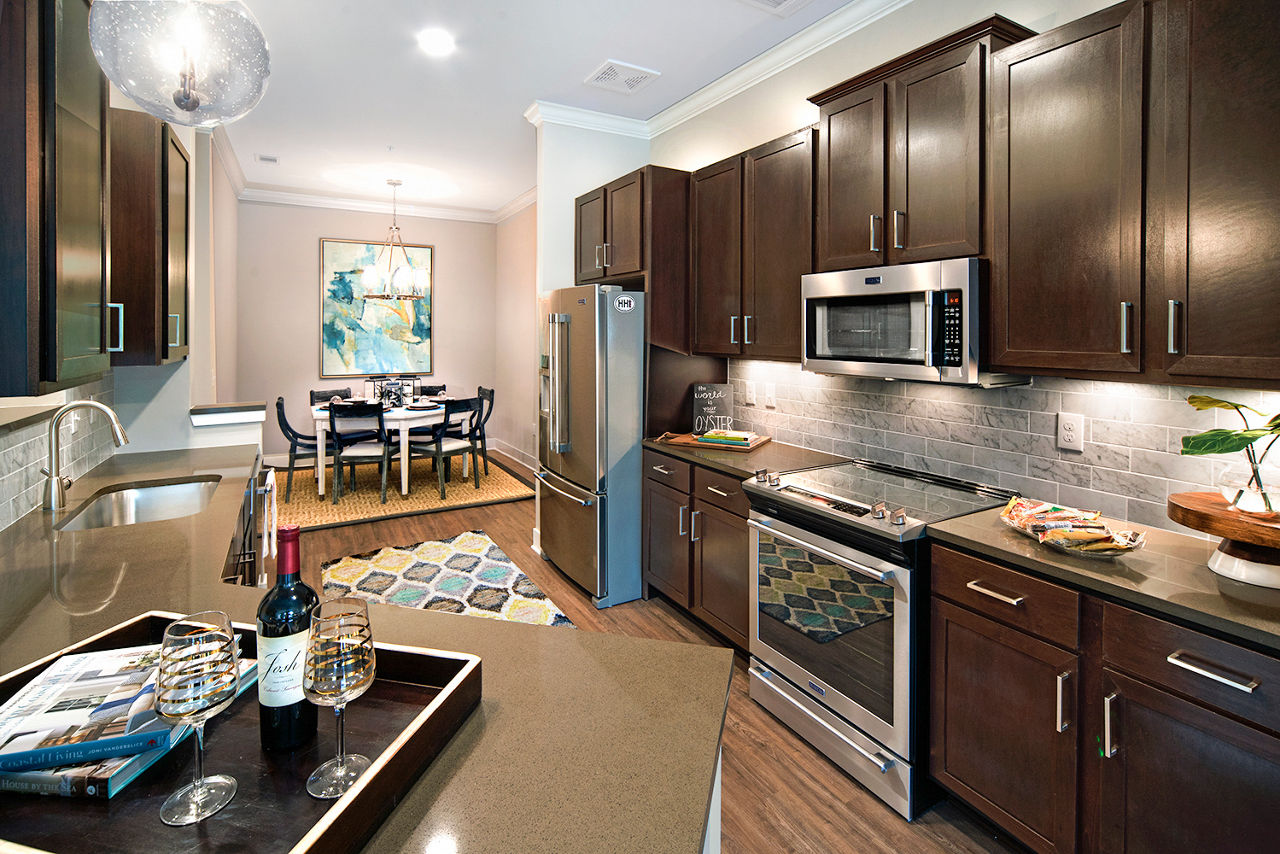 Modern kitchen with sleek appliances at WaterWalk in Shelter Cove Towne Centre