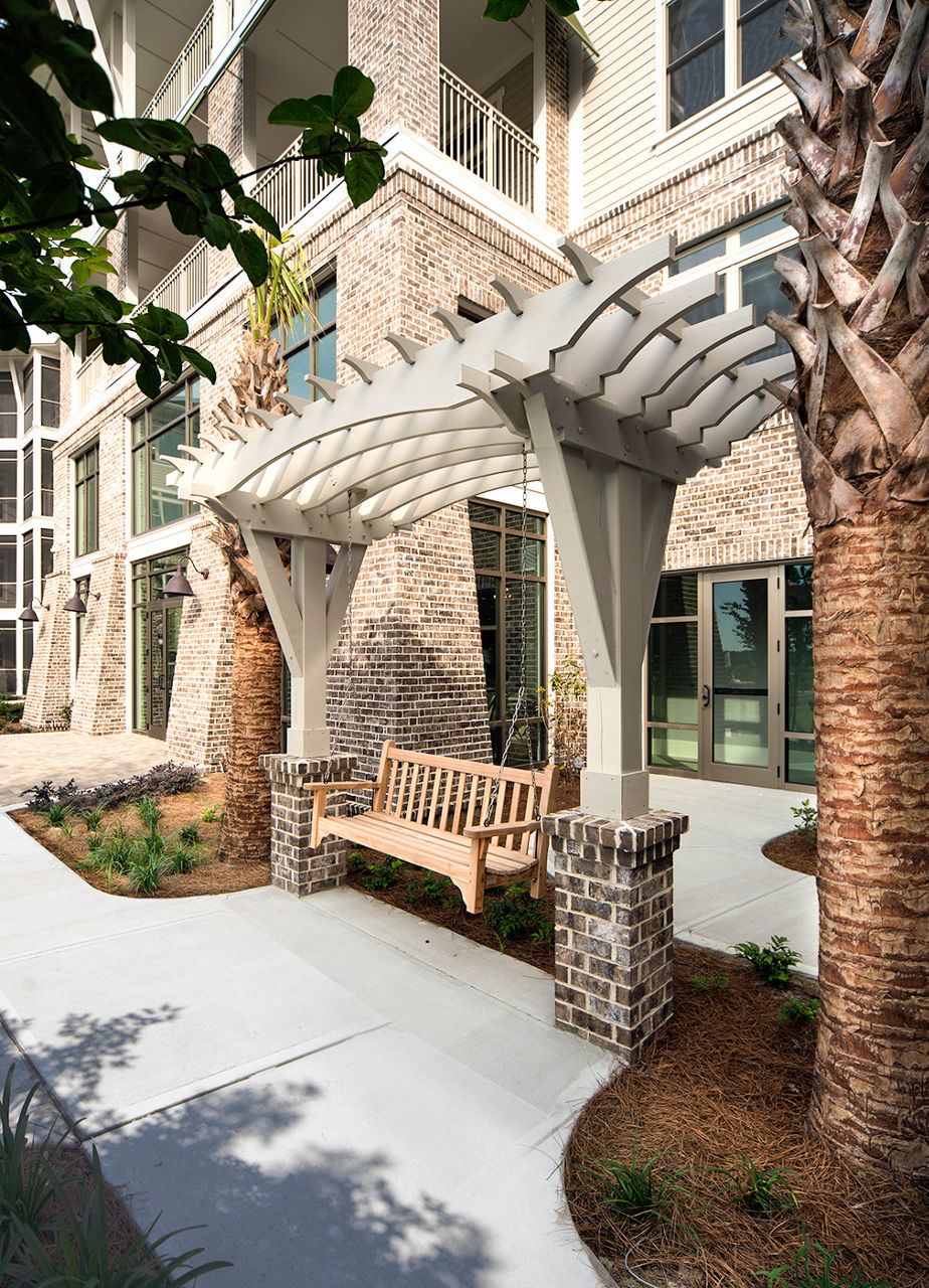 Tranquil courtyard with lush greenery at WaterWalk at Shelter Cove Towne Centre luxury apartments