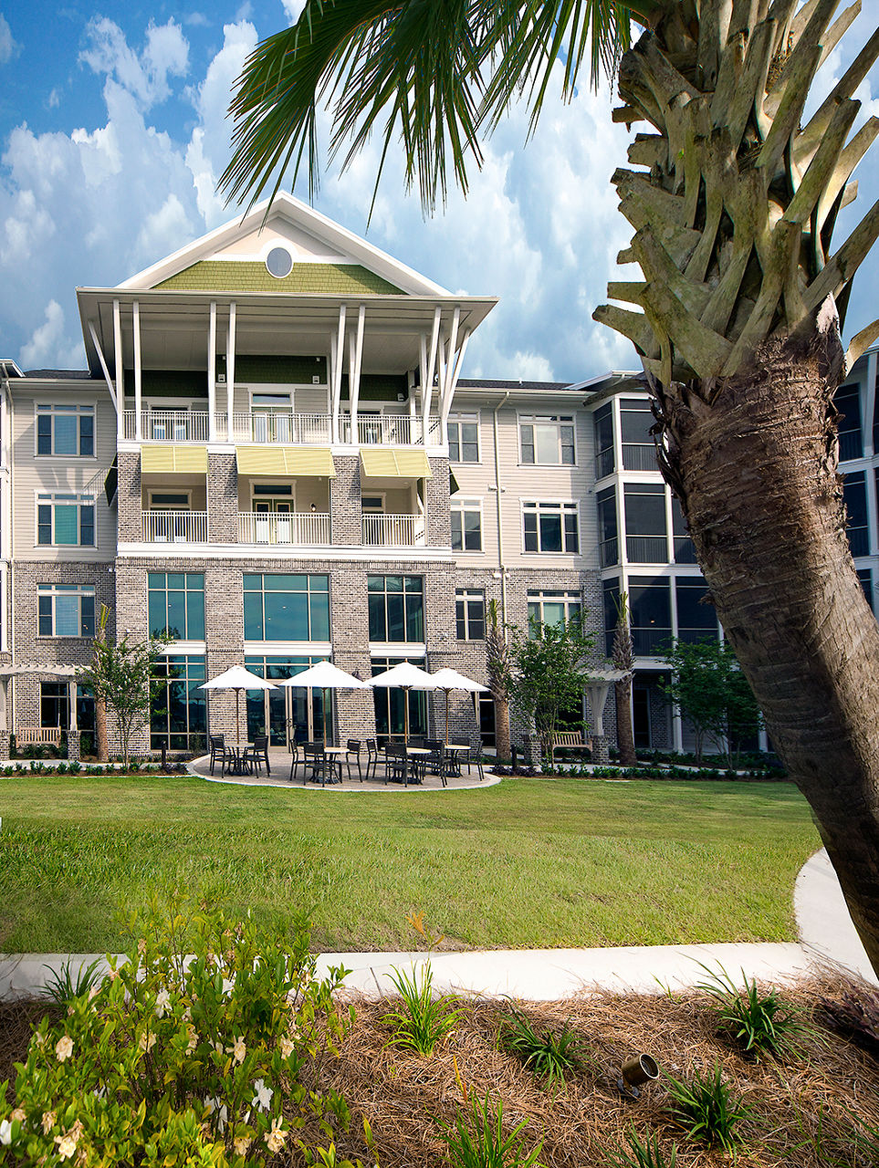 Tranquil courtyard with landscaped gardens at WaterWalk at Shelter Cove Towne Centre luxury apartments