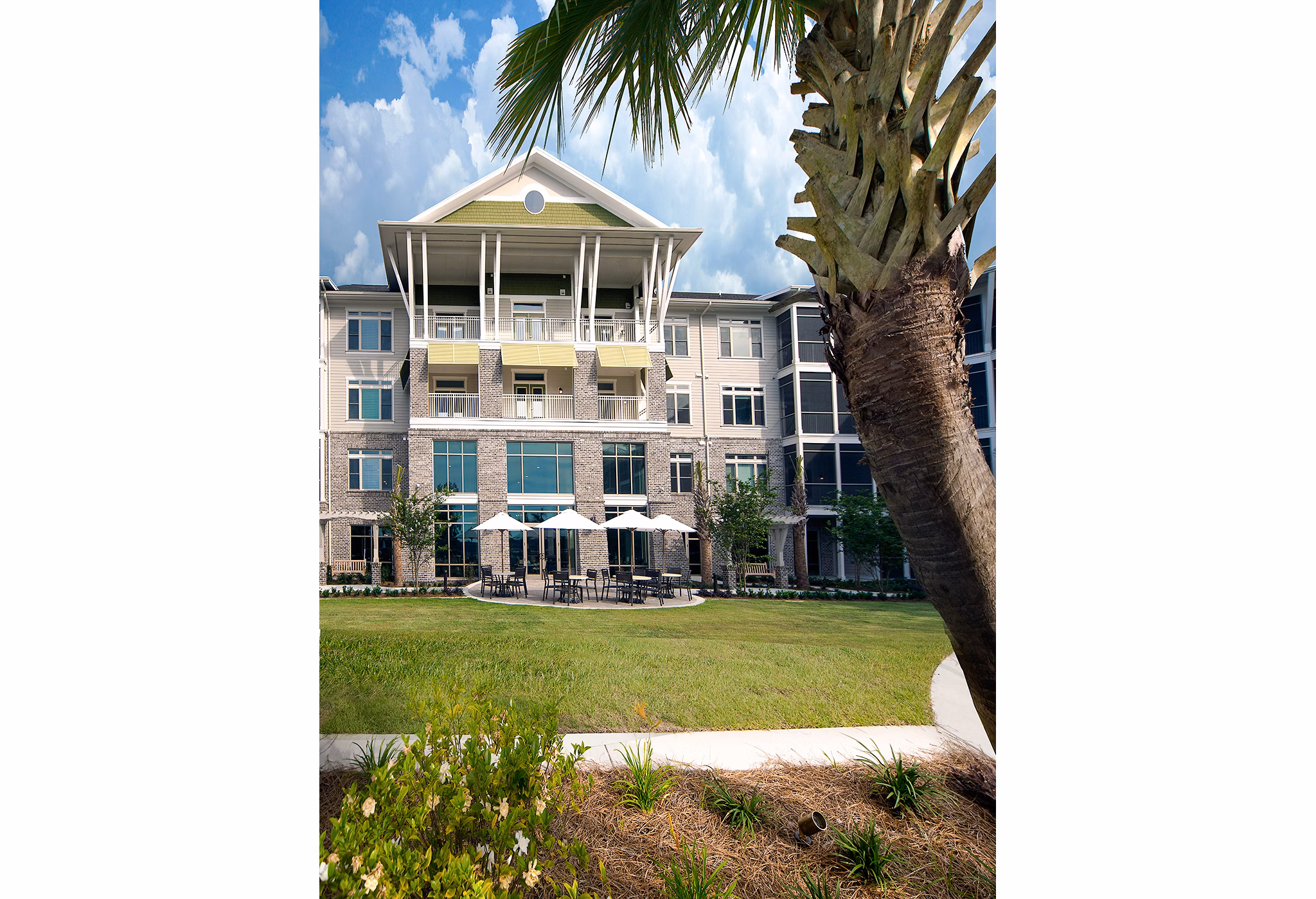 Tranquil courtyard with landscaped gardens at WaterWalk at Shelter Cove Towne Centre luxury apartments