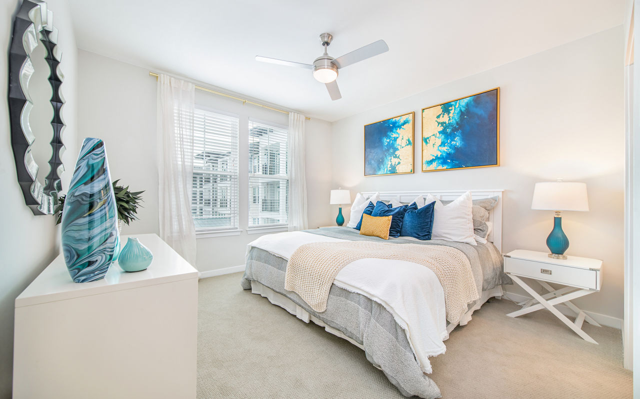 Spacious bedroom with elegant decor at Overture Daniel Island Apartments, offering luxury living in a vibrant community