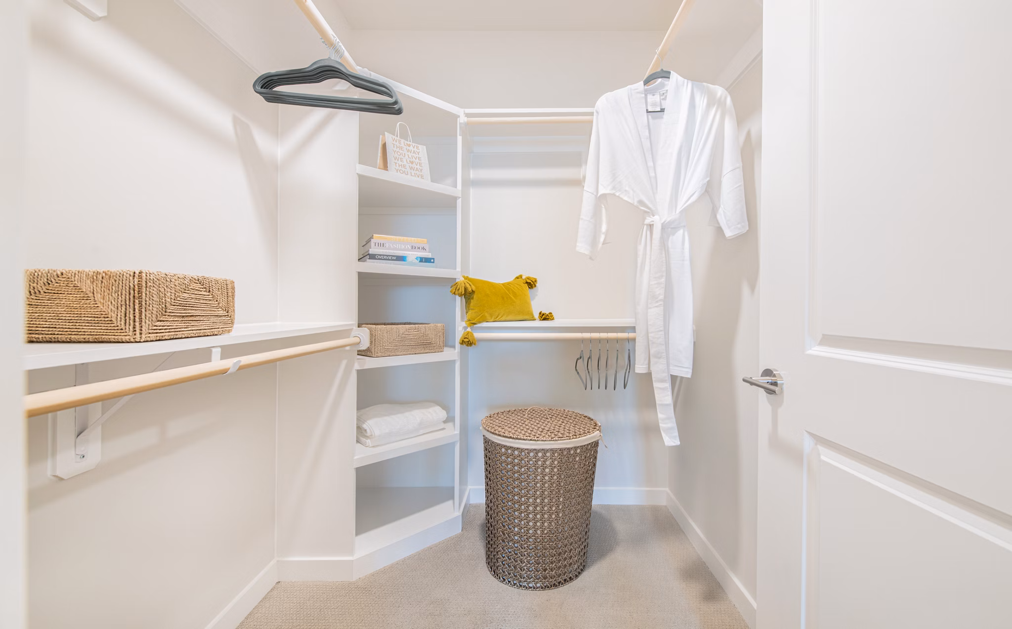 Walk-in closet with ample shelving at Overture Daniel Island Apartments, luxury living spaces