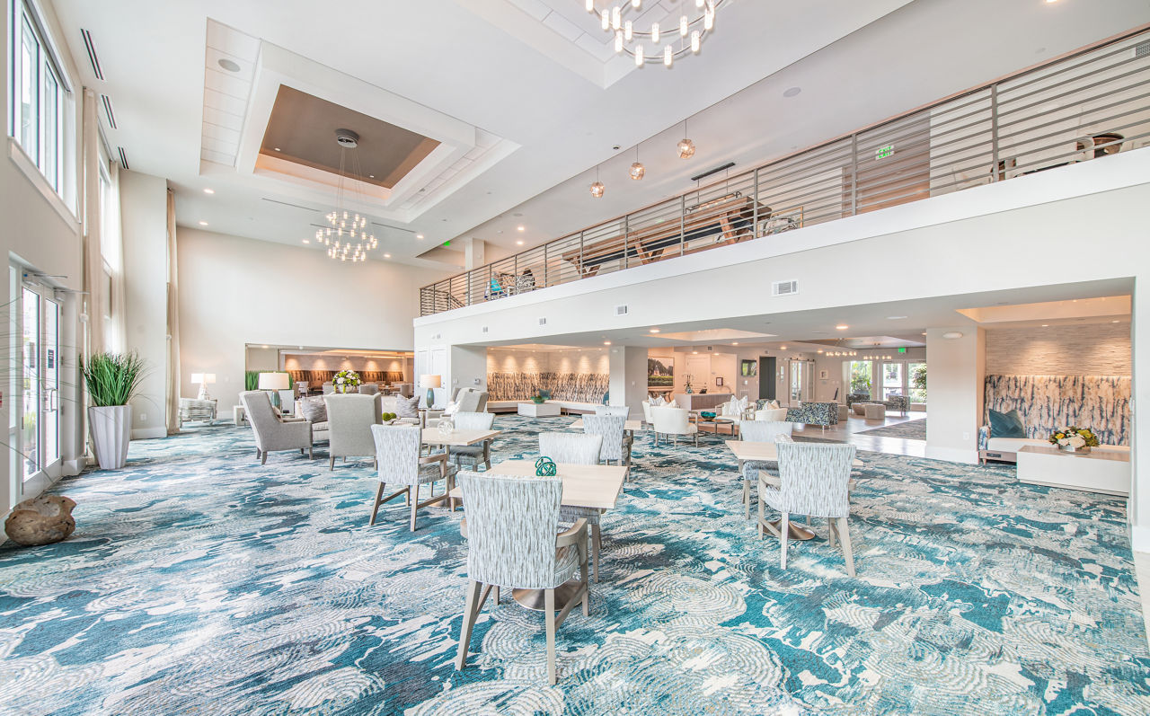 Clubhouse with modern decor and lounge seating at Overture Daniel Island Apartments in Charleston