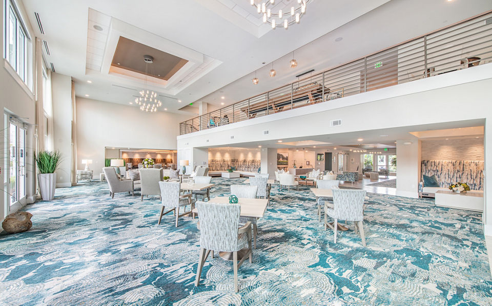 Clubhouse with modern decor and lounge seating at Overture Daniel Island Apartments in Charleston