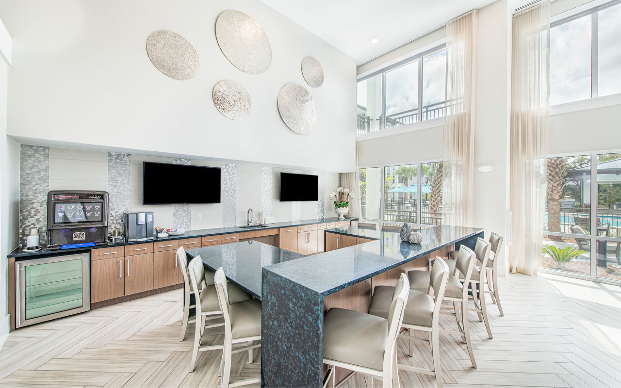 Clubhouse featuring modern design and cozy seating areas at Overture Daniel Island Apartments, offering luxury living in Charleston