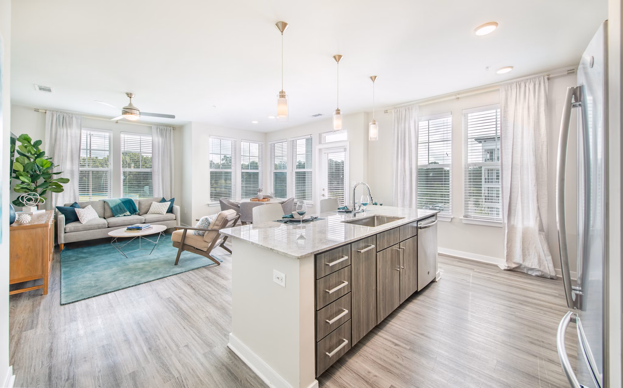 Modern kitchen with sleek countertops and stainless steel appliances at Overture Daniel Island Apartments, a Greystar luxury community