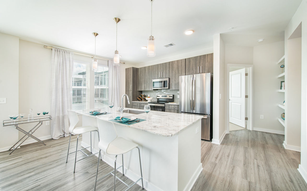 Modern kitchen with stainless steel appliances at Overture Daniel Island Apartments, Greystar luxury apartments in Charleston, SC