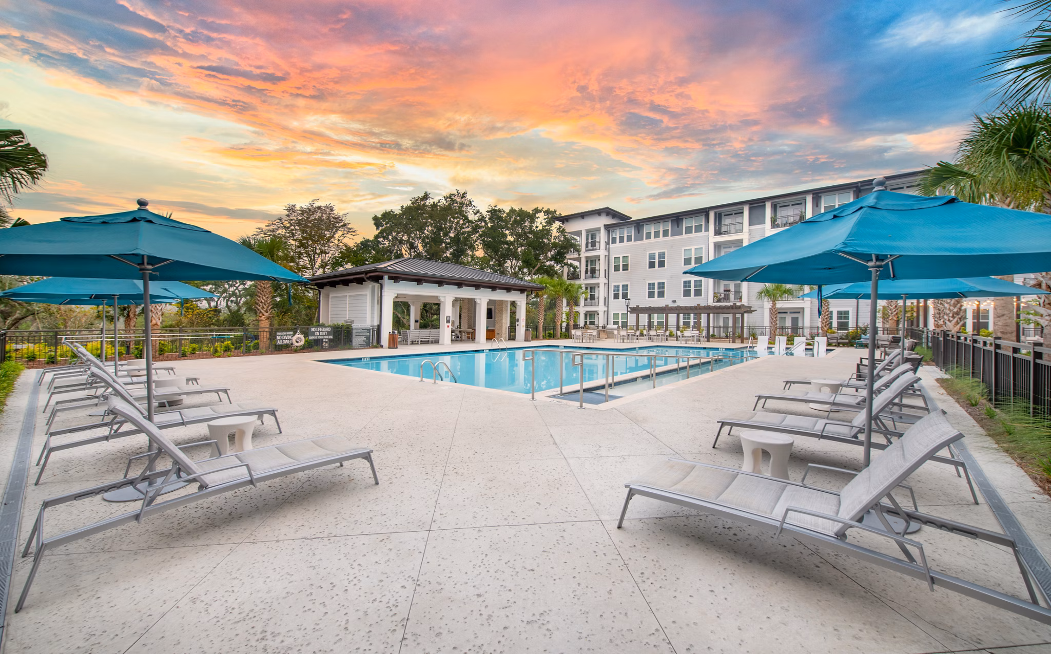 Resort-style pool with lounge chairs at Overture Daniel Island luxury apartments