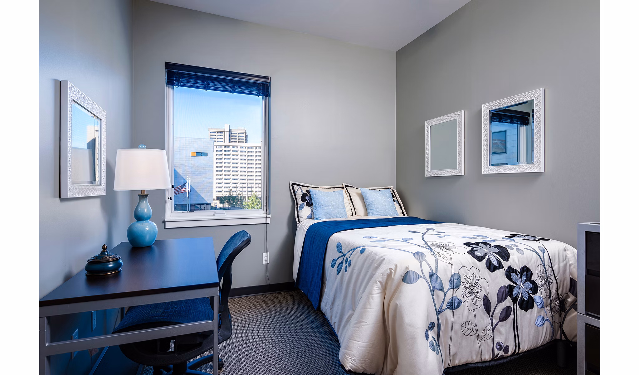 Spacious bedroom with modern decor and ample natural light at Campus West Apartments