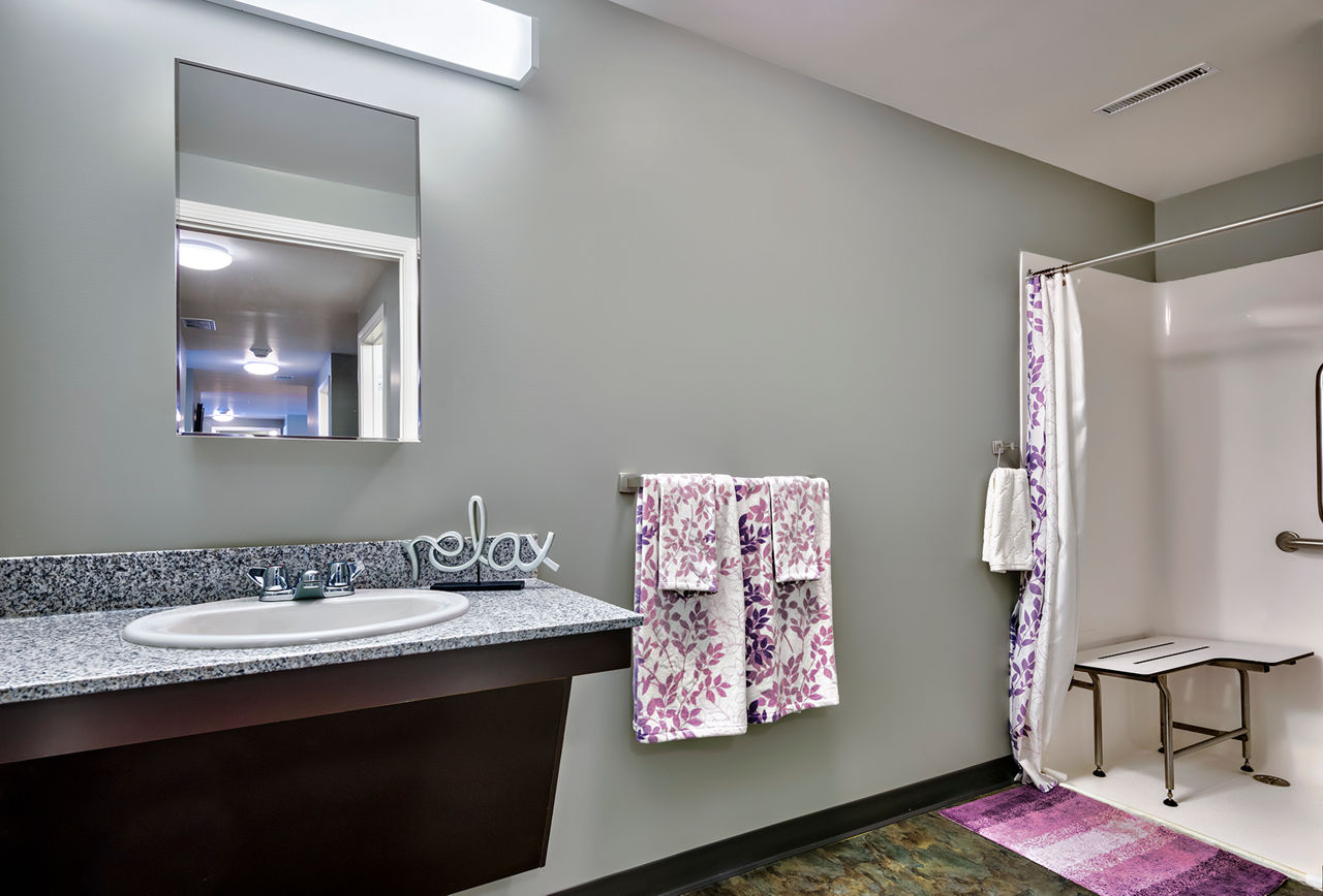 Modern bathroom with sleek fixtures in Campus West Apartments, offering luxury student living near campus