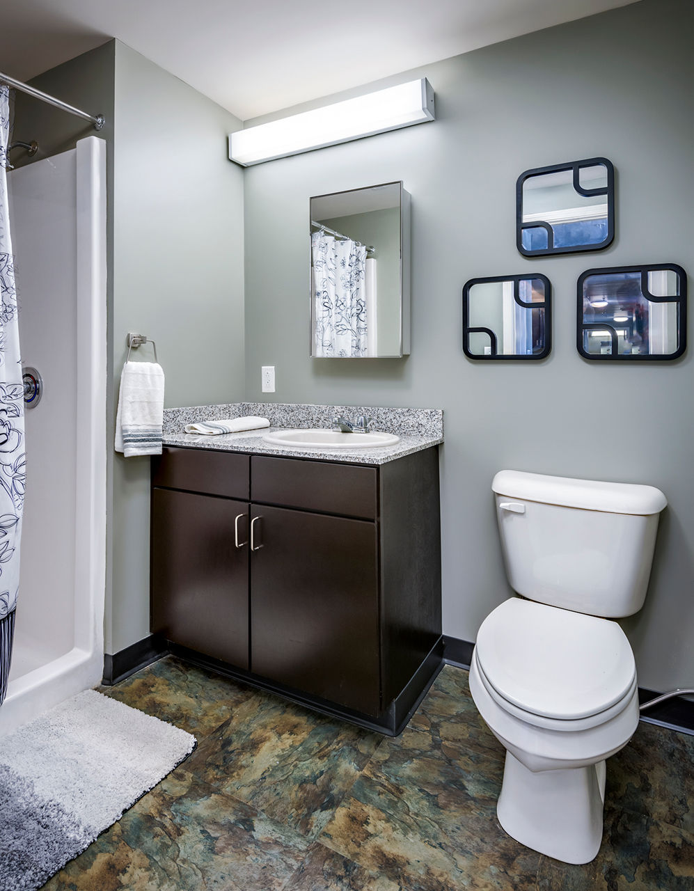 Modern bathroom with sleek fixtures at Campus West Apartments
