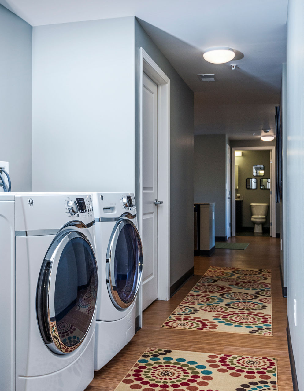 Laundry room featuring state-of-the-art washers and dryers in Campus West Apartments at Greystar luxury apartments