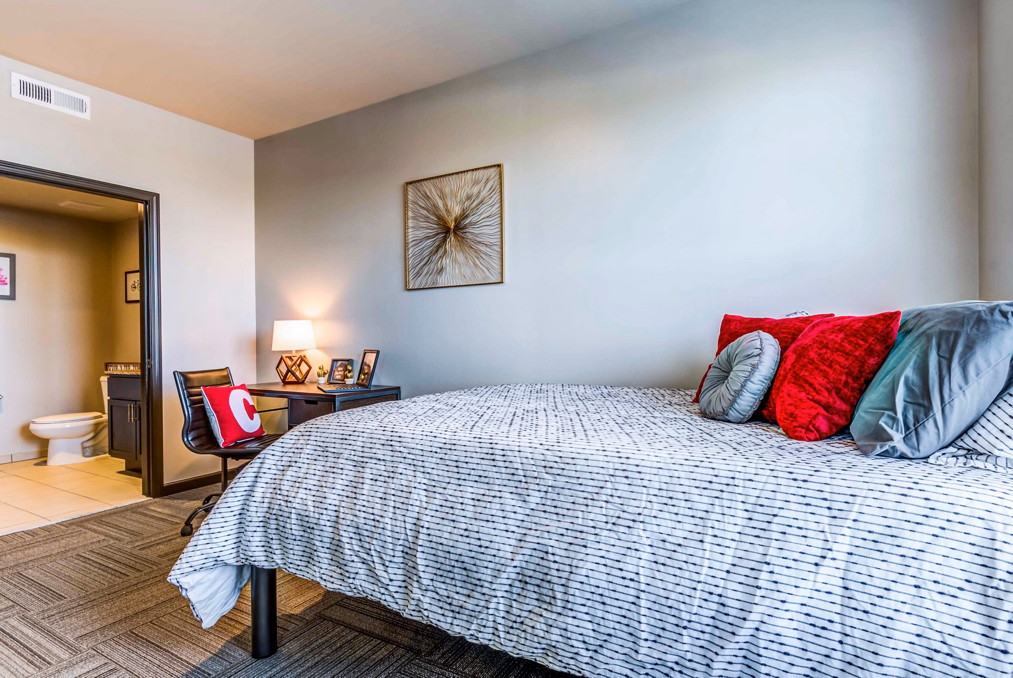 Cozy bedroom featuring natural light and modern decor at Maplewood Apartments