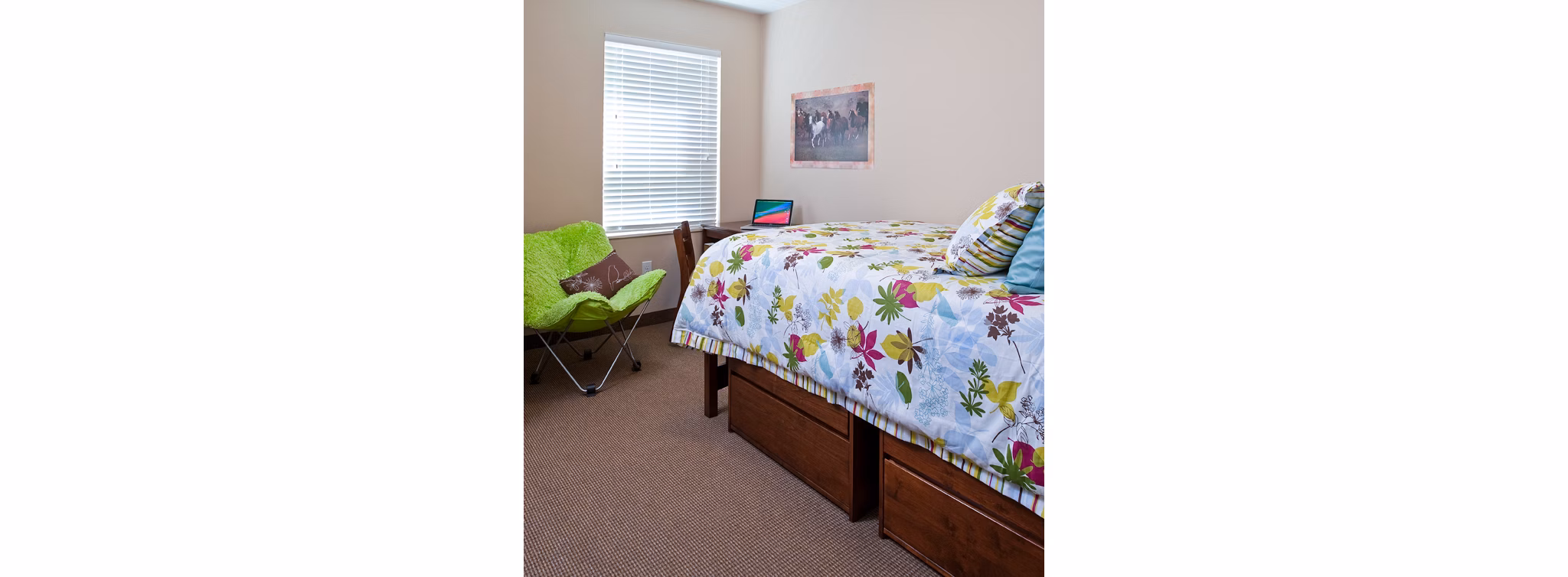 Cozy bedroom with modern furnishings at Centennial Hall Apartments