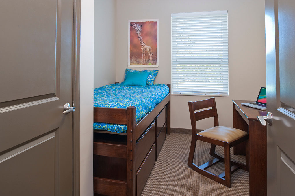 Cozy bedroom featuring modern decor at Centennial Hall Apartments