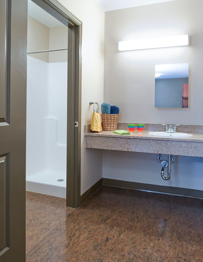 Modern bathroom with sleek fixtures in Centennial Hall Apartments, offering luxury amenities and style
