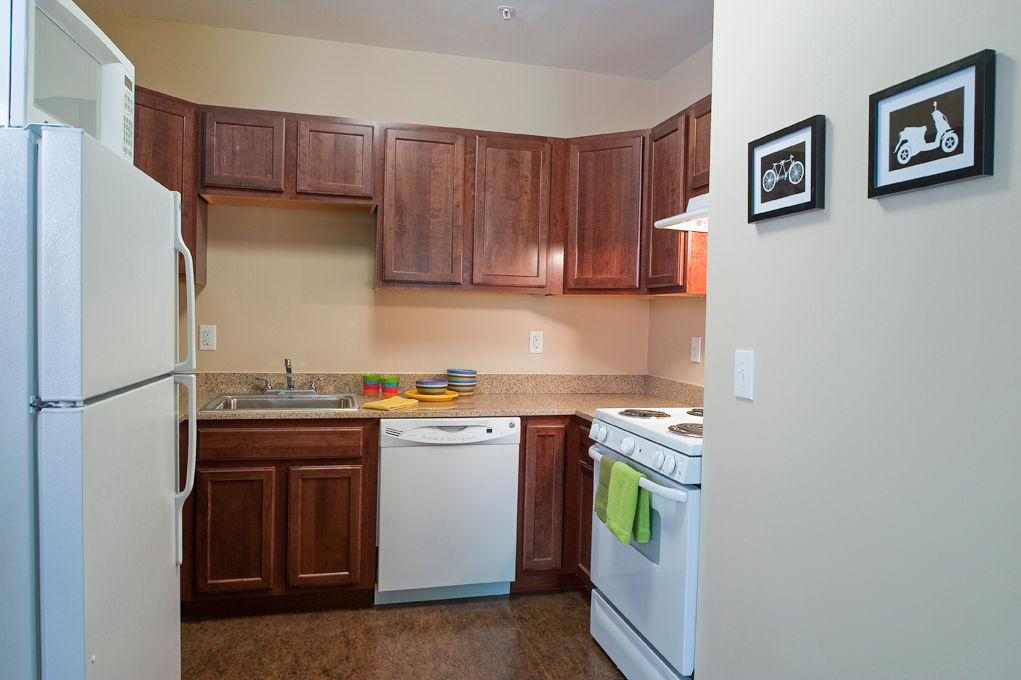Modern kitchen with stainless steel appliances at Centennial Hall Apartments