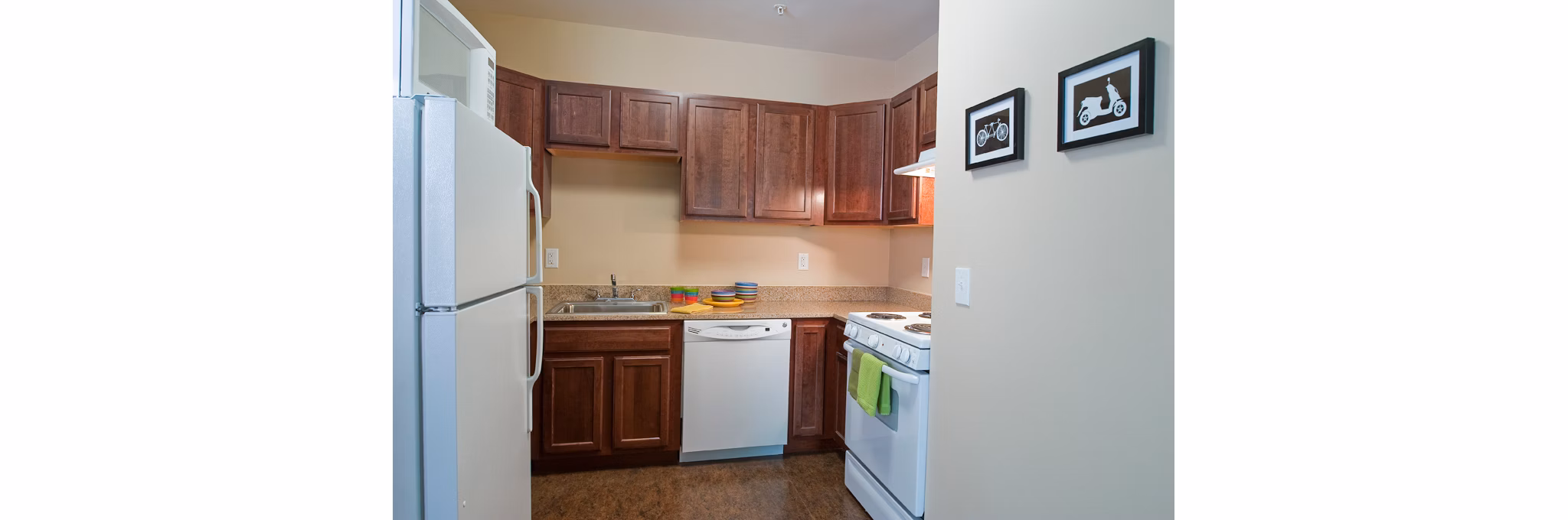 Modern kitchen with stainless steel appliances at Centennial Hall Apartments