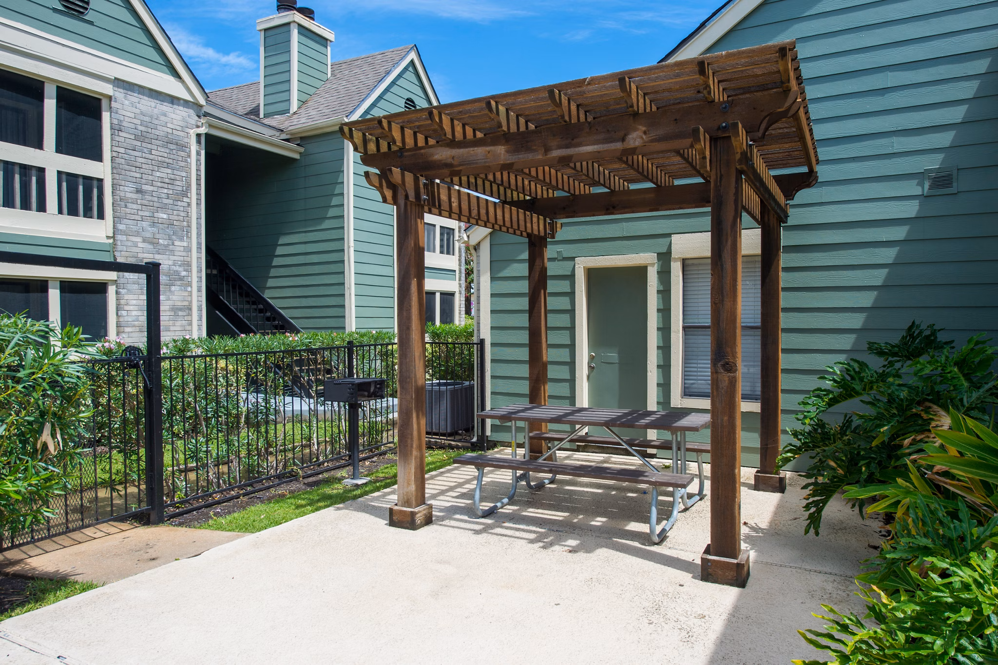 Modern outdoor grill area with stainless steel appliances at Willow Springs Apartments, perfect for social gatherings and BBQs