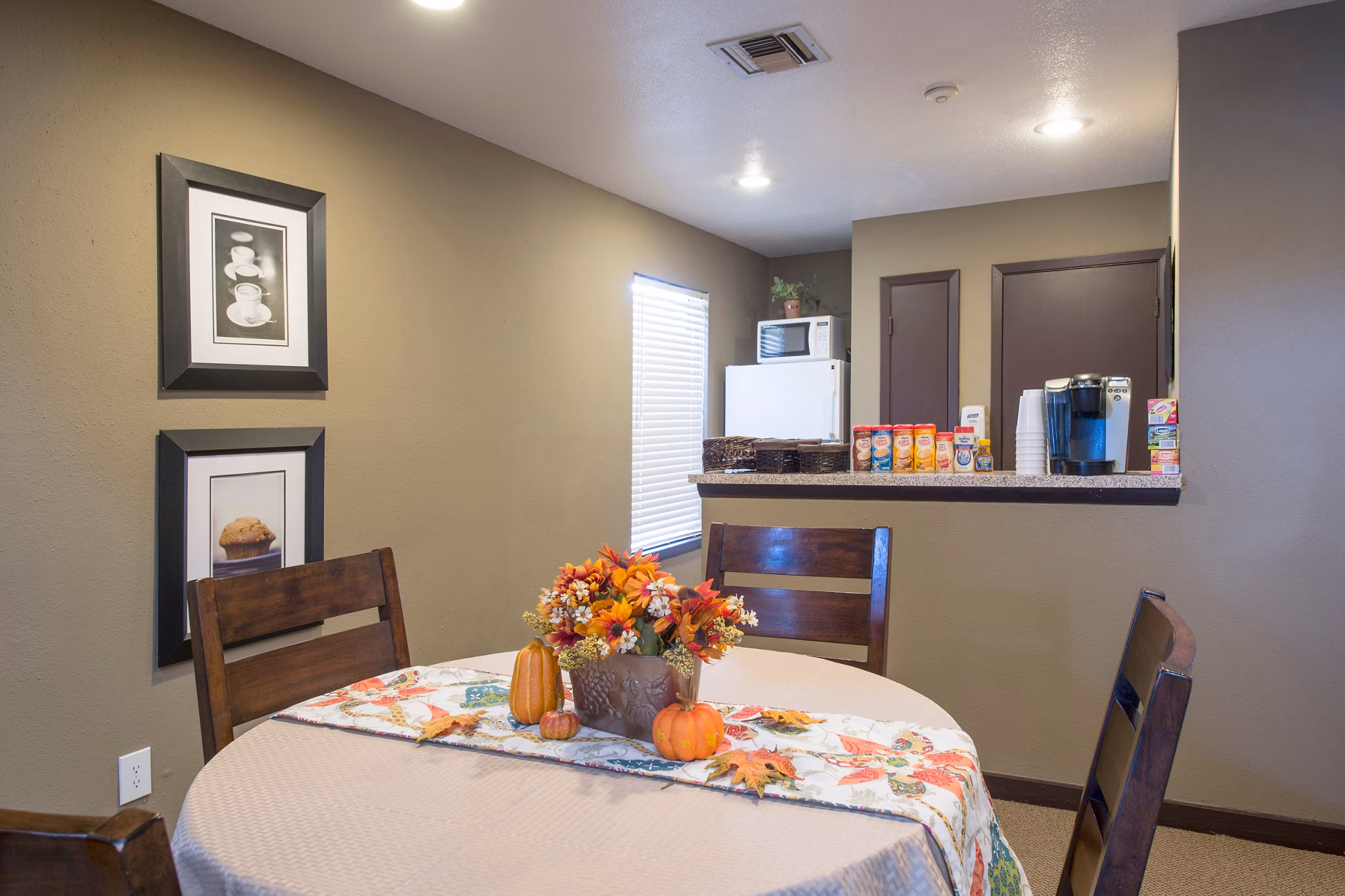 Contemporary clubhouse with outdoor seating at Willow Springs Apartments