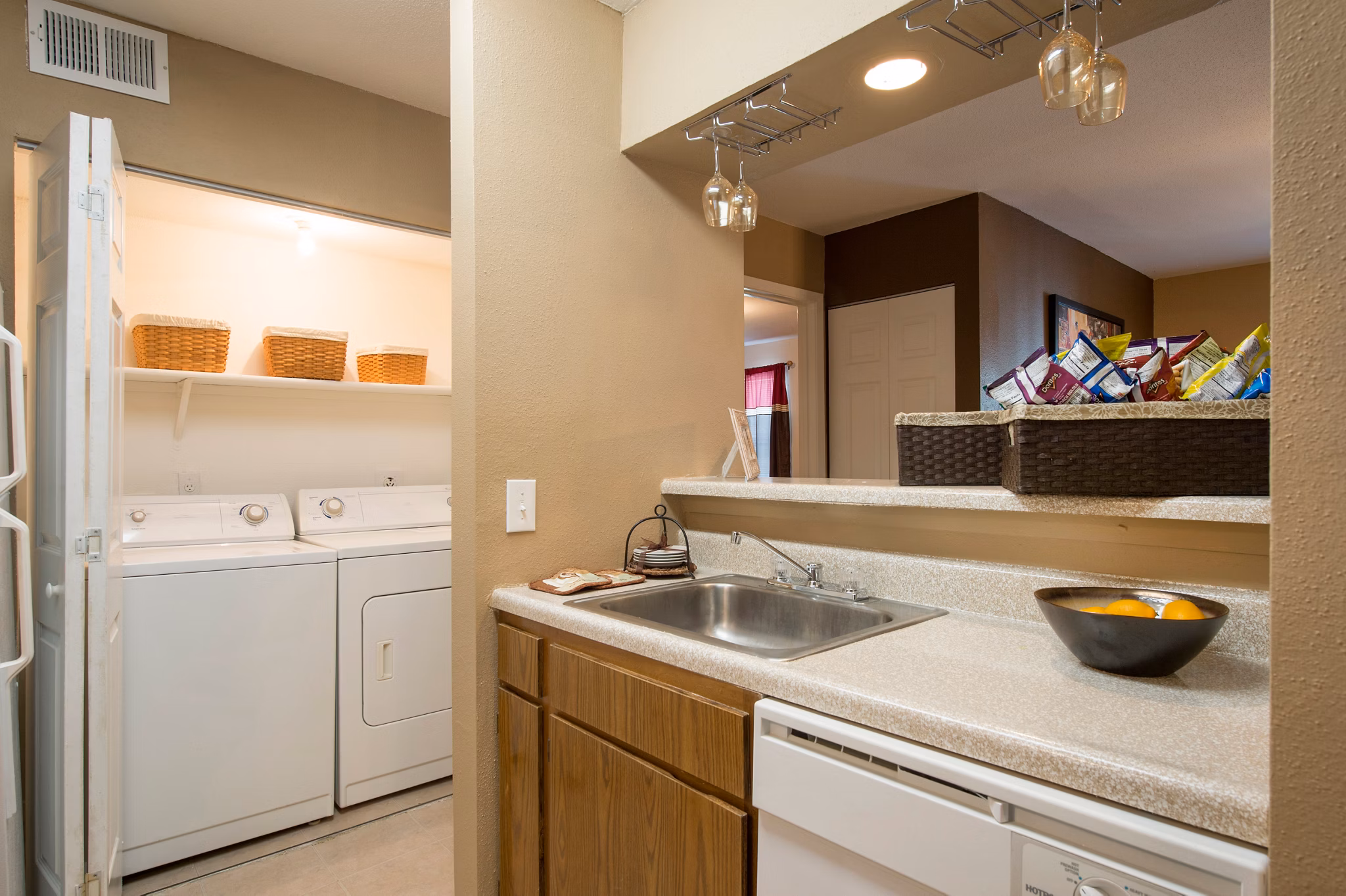 Laundry room featuring modern appliances at Willow Springs Apartments