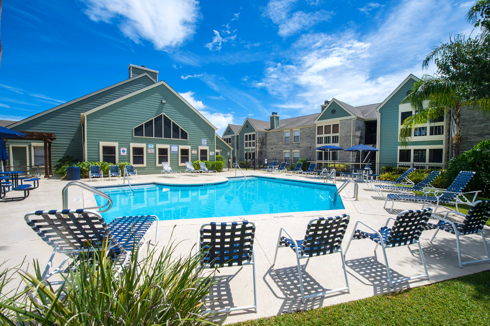 Resort-style pool with sun deck at Willow Springs Apartments