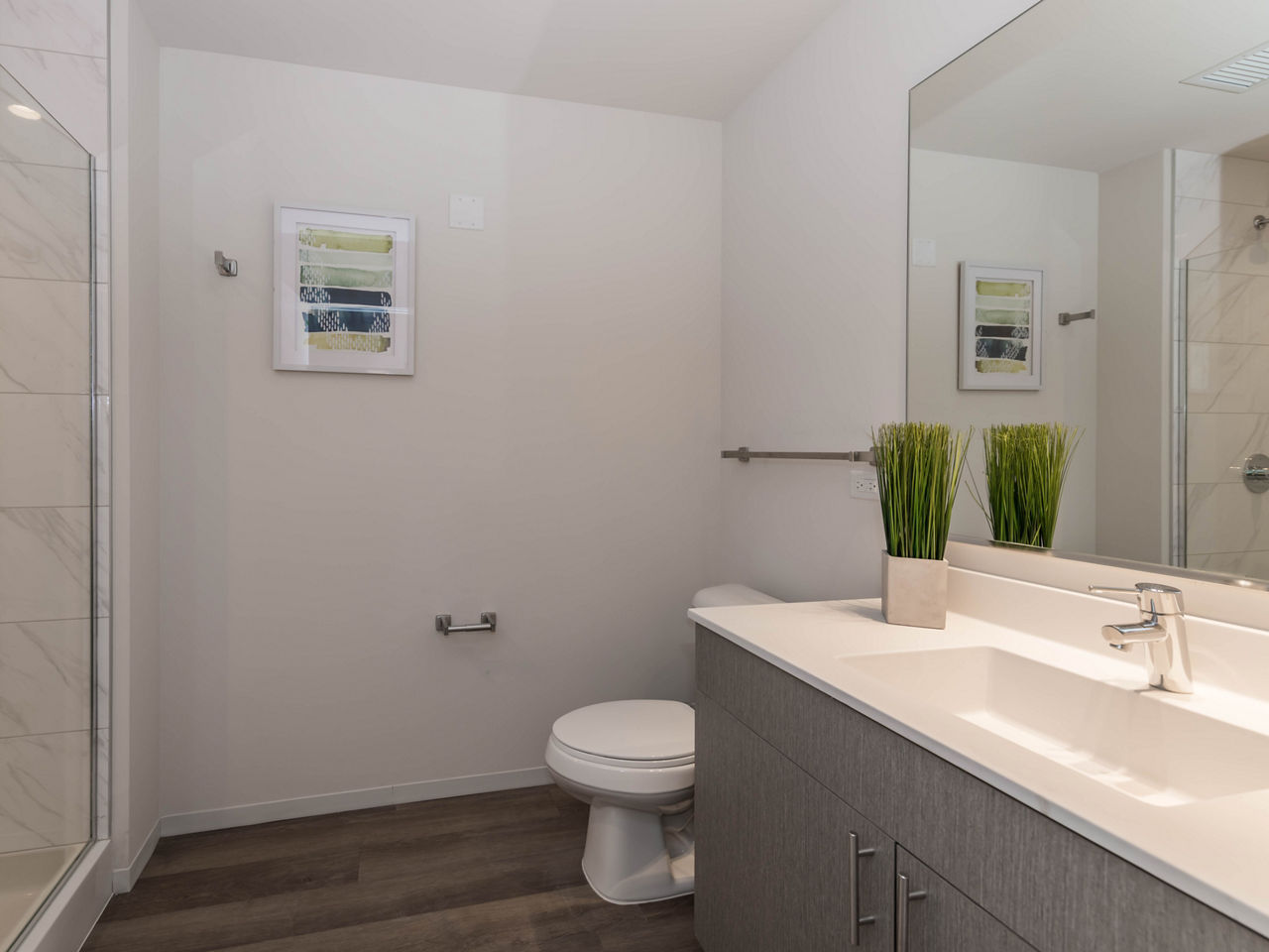 Luxurious bathroom with marble finishes and modern fixtures in Coeval Apartments