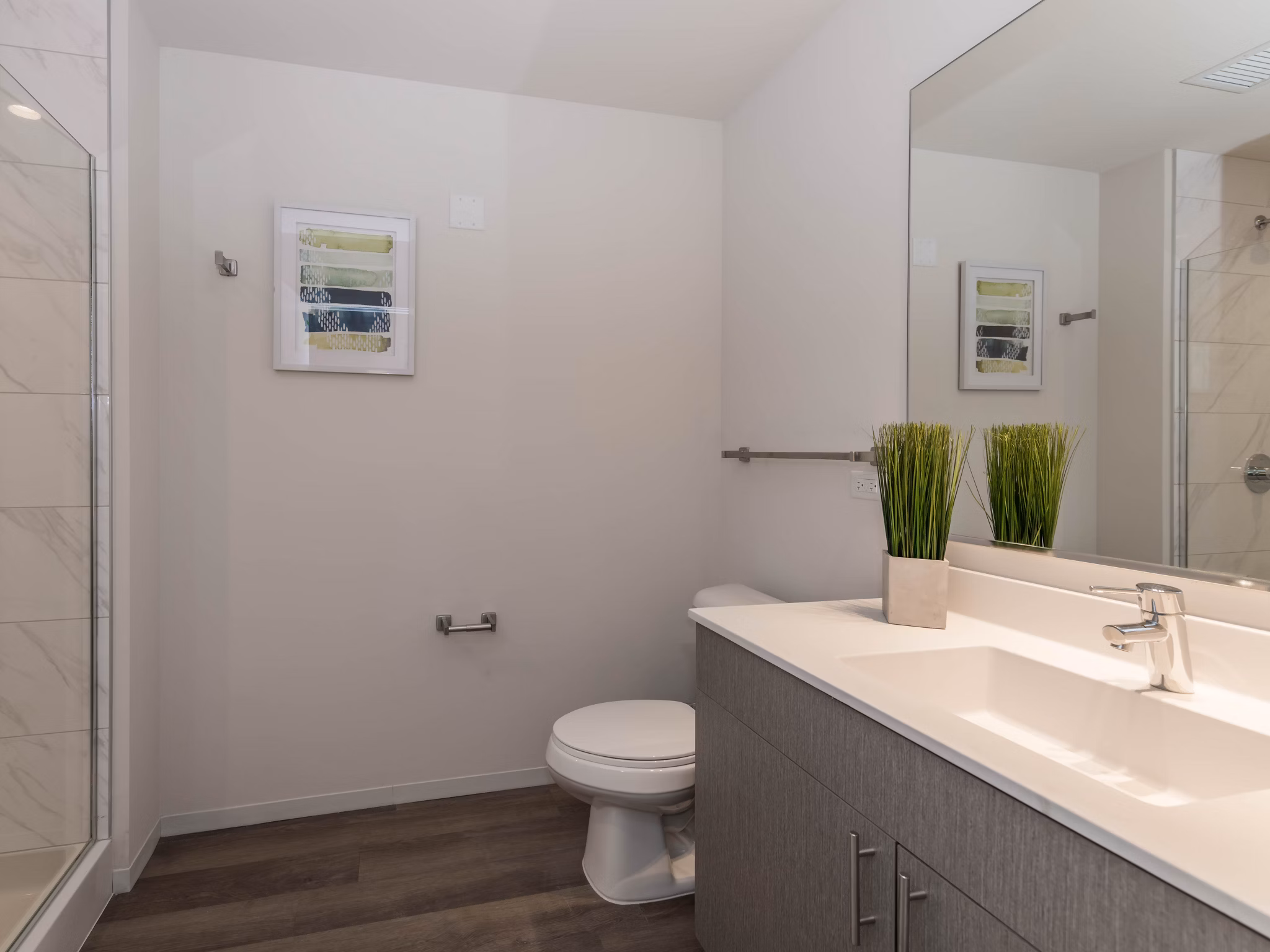 Luxurious bathroom with marble finishes and modern fixtures in Coeval Apartments