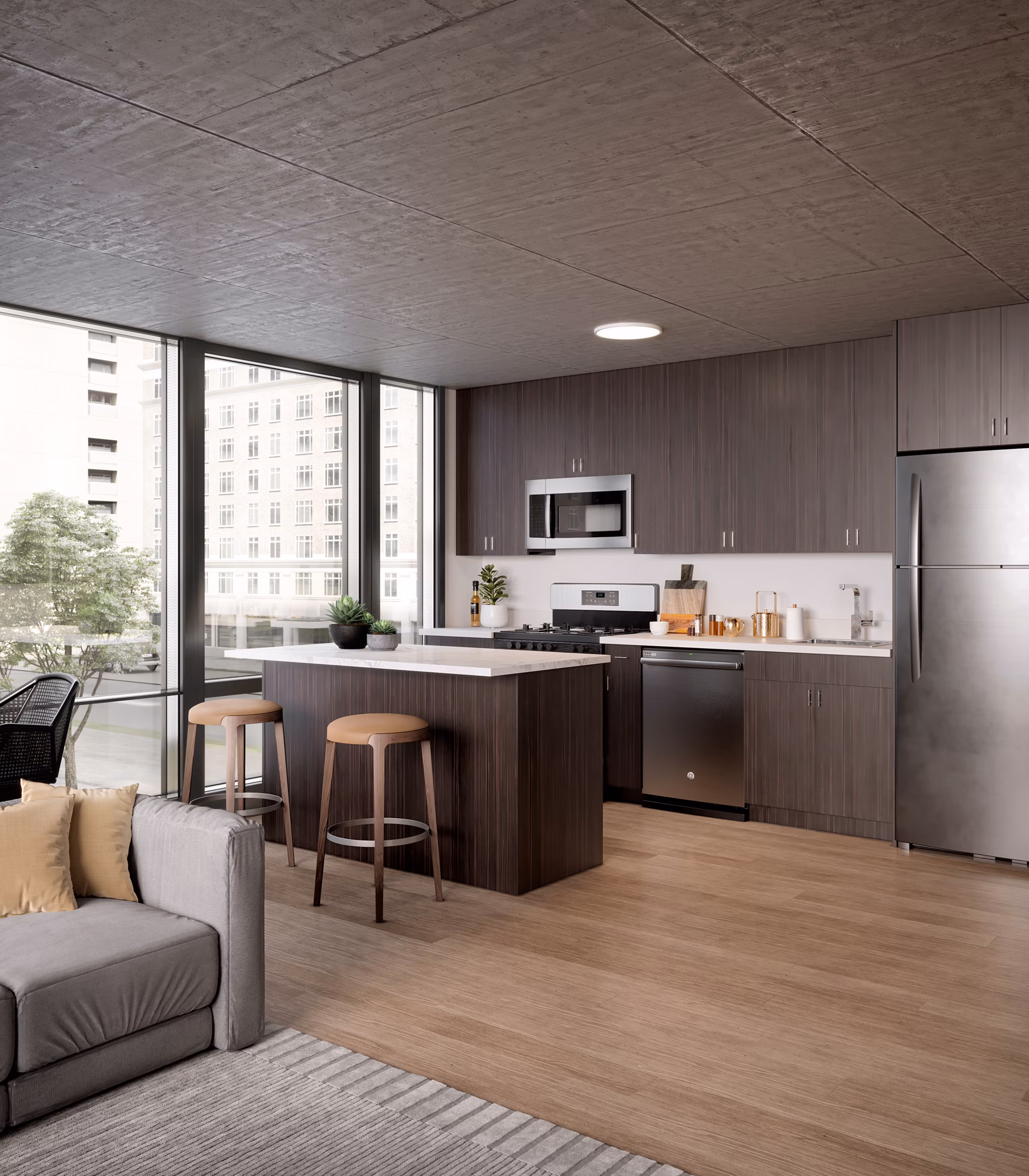 Modern kitchen with stainless steel appliances at Coeval Apartments, providing luxury living in a prime location