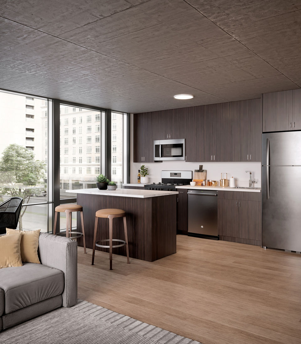 Modern kitchen with stainless steel appliances at Coeval Apartments, providing luxury living in a prime location