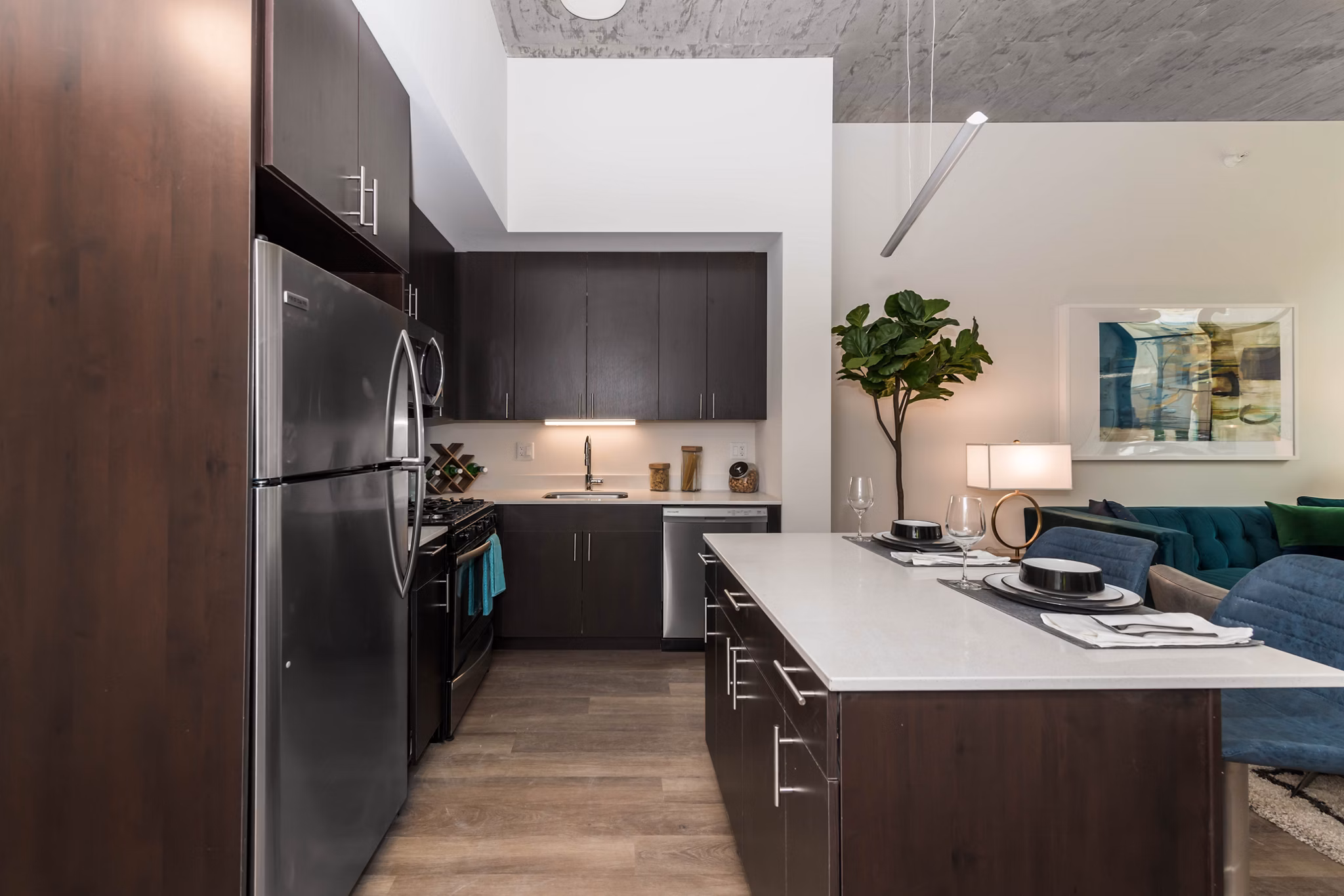 Modern kitchen with sleek countertops and stainless steel appliances in Coeval Apartments