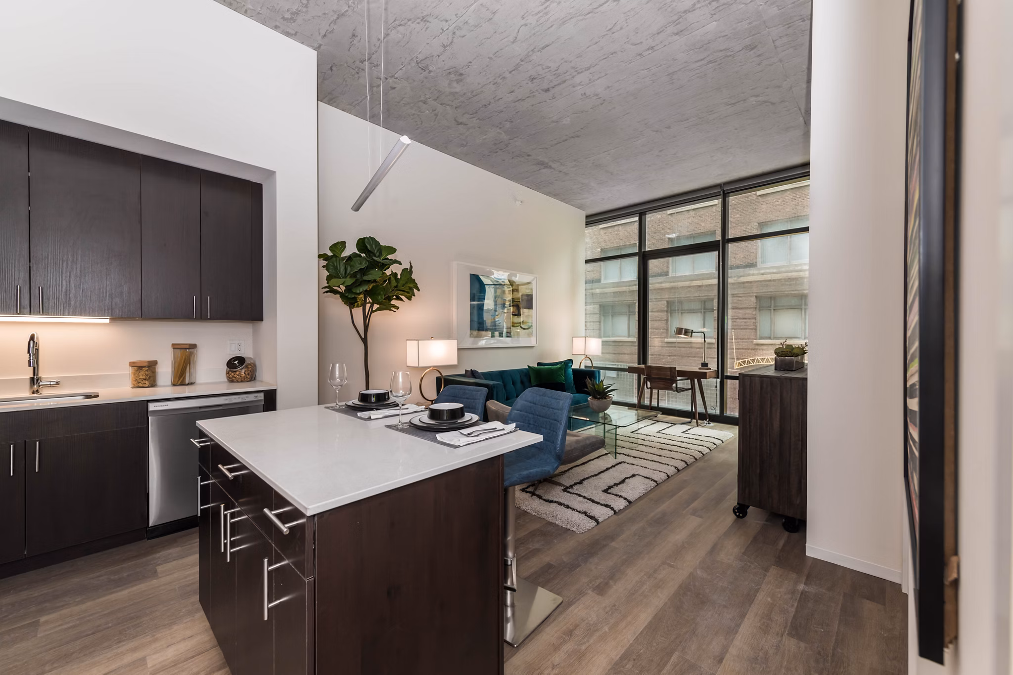 Spacious kitchen featuring sleek countertops and modern appliances in Coeval Apartments, luxury living in the city
