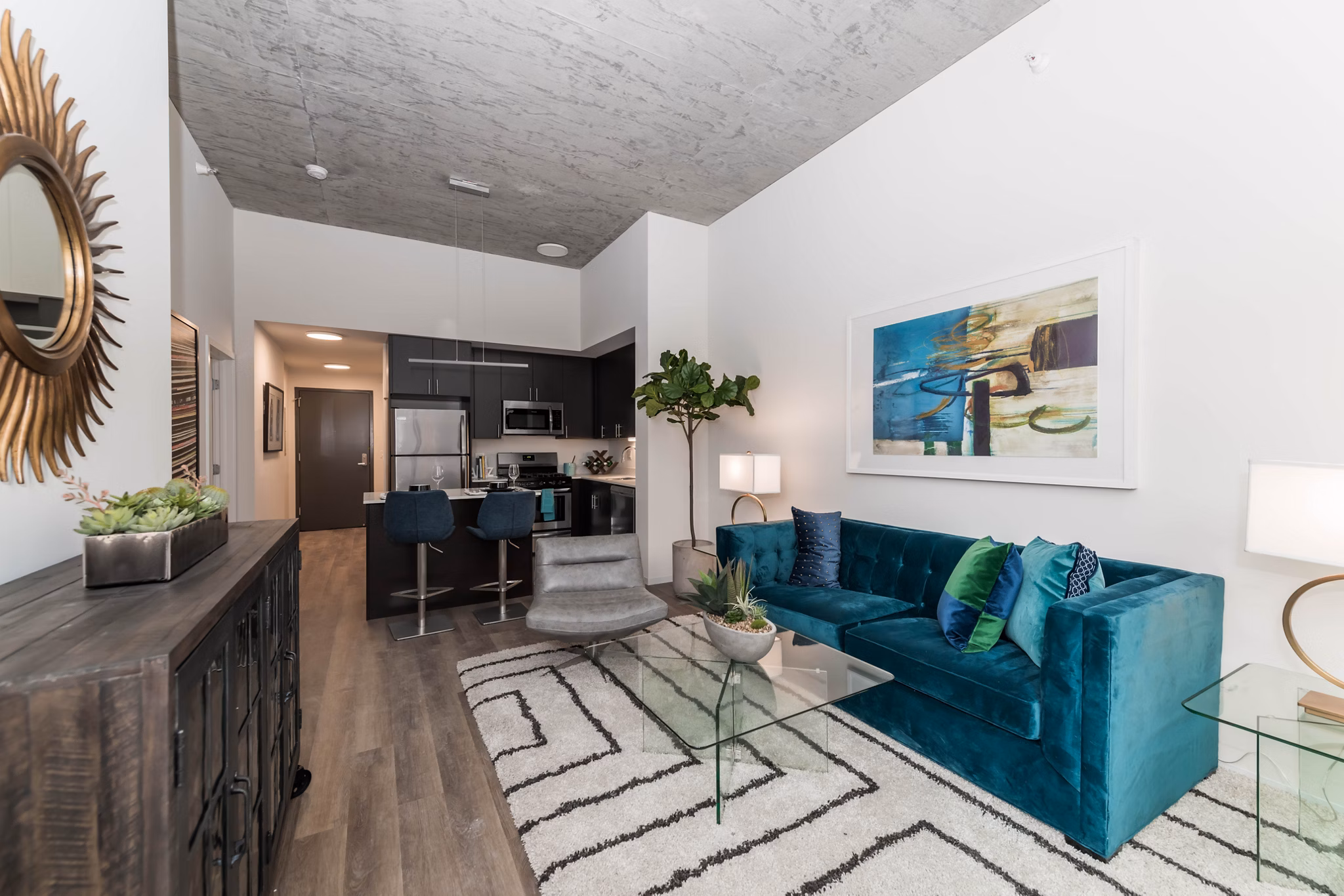 Stylish living room with modern decor and natural light at Coeval Apartments