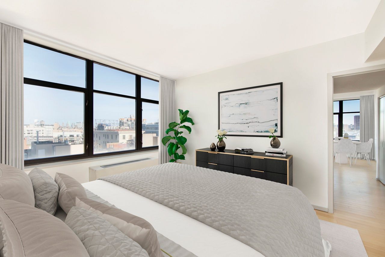 Bedroom featuring modern decor and large windows in 424 Bedford luxury apartments