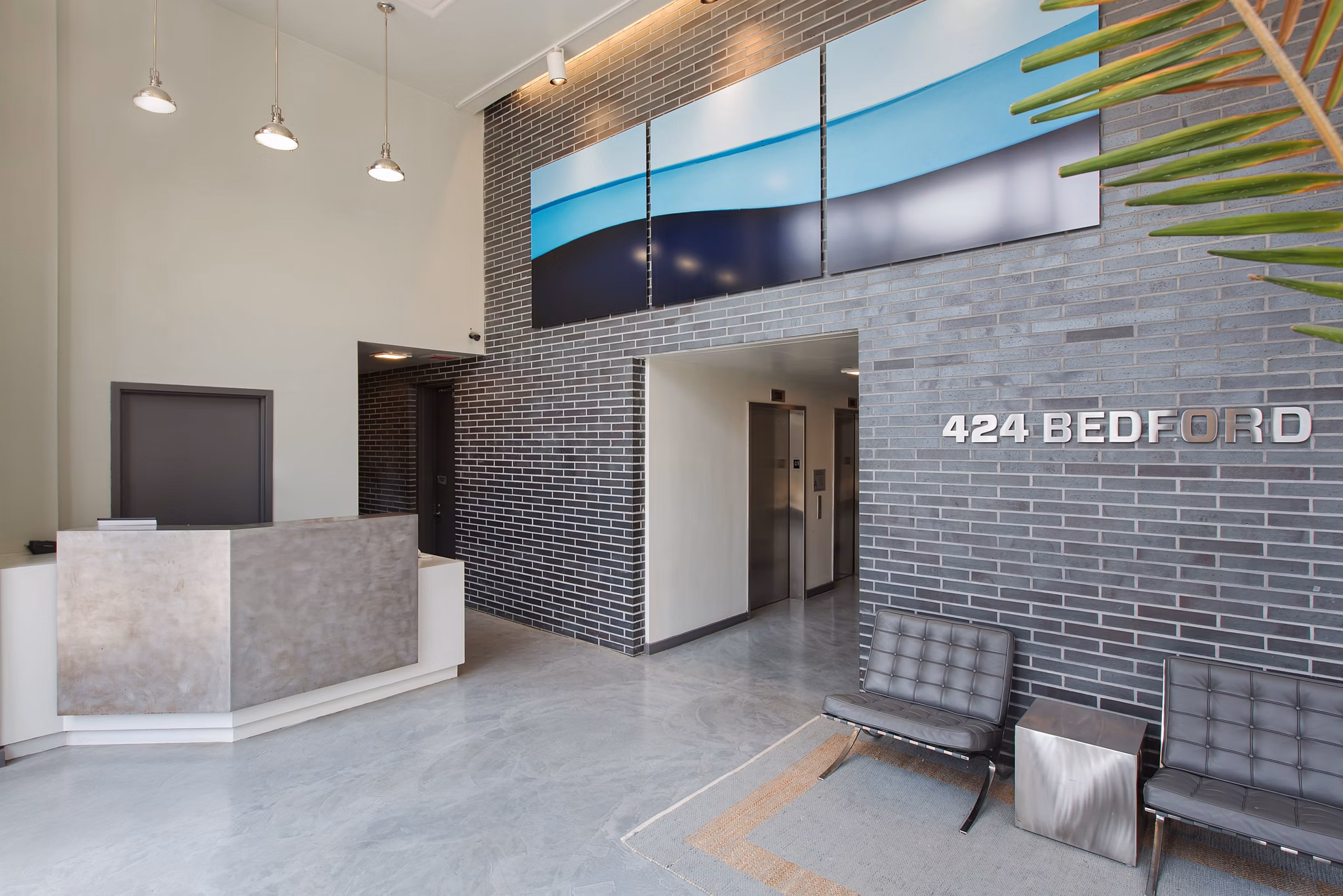 Elegant clubhouse at 424 Bedford luxury apartments with modern furnishings and community spaces