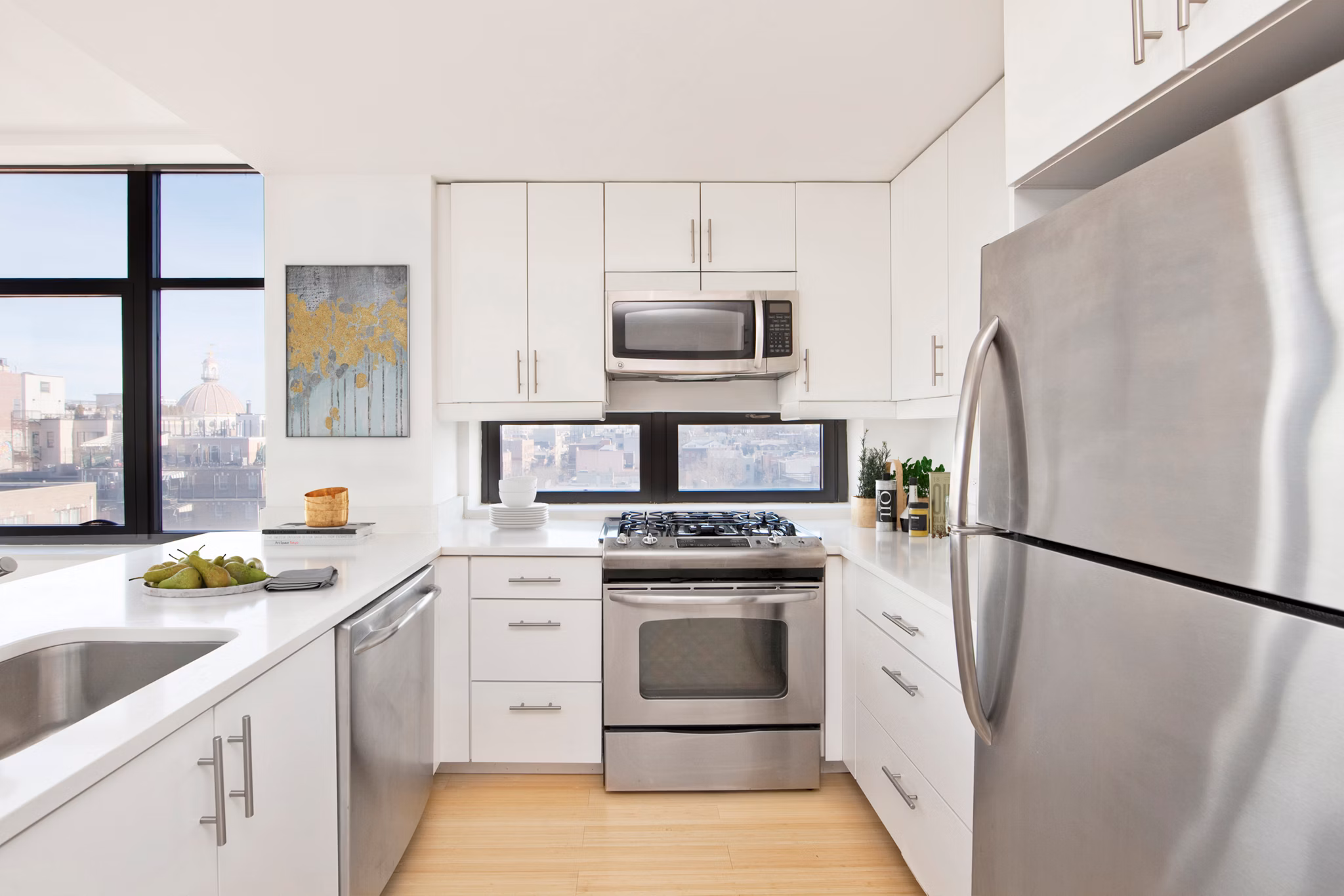 Contemporary kitchen with stainless steel appliances at 424 Bedford luxury apartments