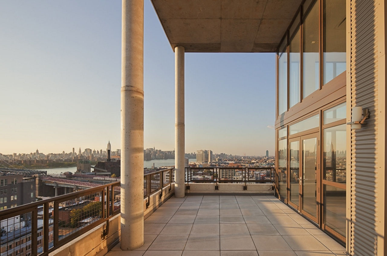 Patio with modern furniture at 424 Bedford luxury apartments, perfect outdoor space for relaxation